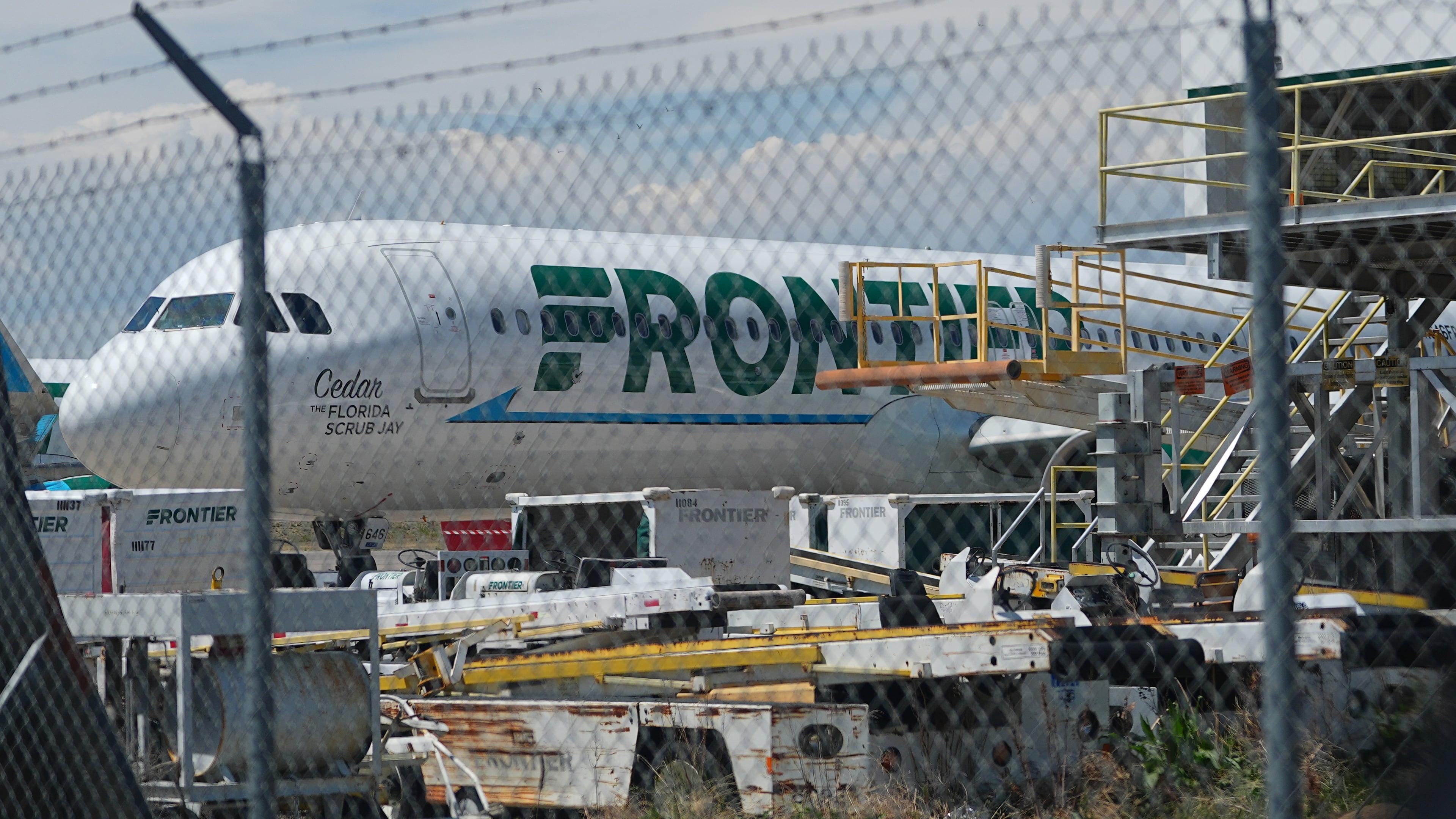 Frontier Airlines jetliner number n646fr sits outside the airlines technical operations center with other jetliners in for service north of Denver International Airport Saturday, May 9, 2026, in Denver. (AP Photo/David Zalubowski)