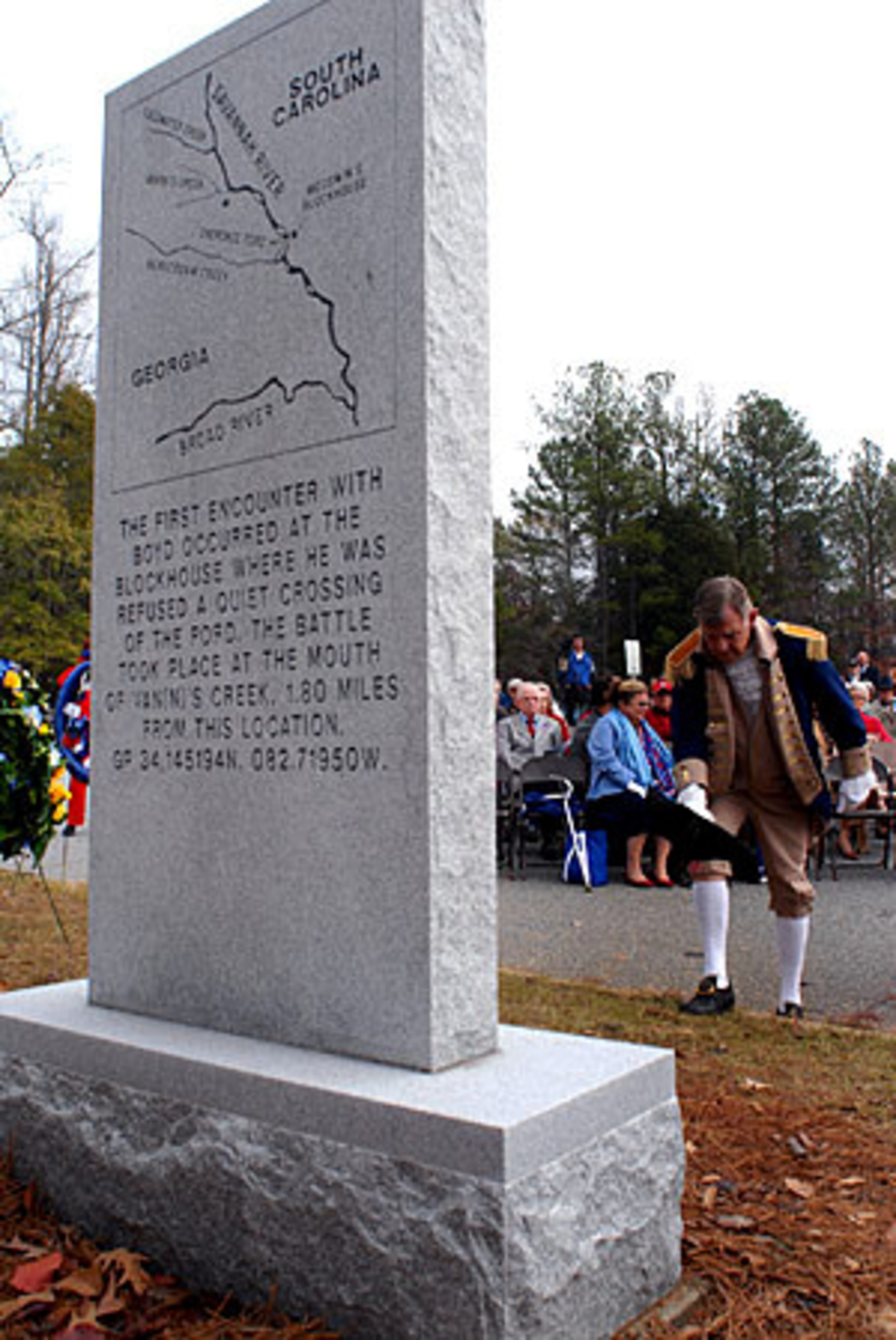 A member of the Sons of the American Revolution pays his respects during the ceremony.