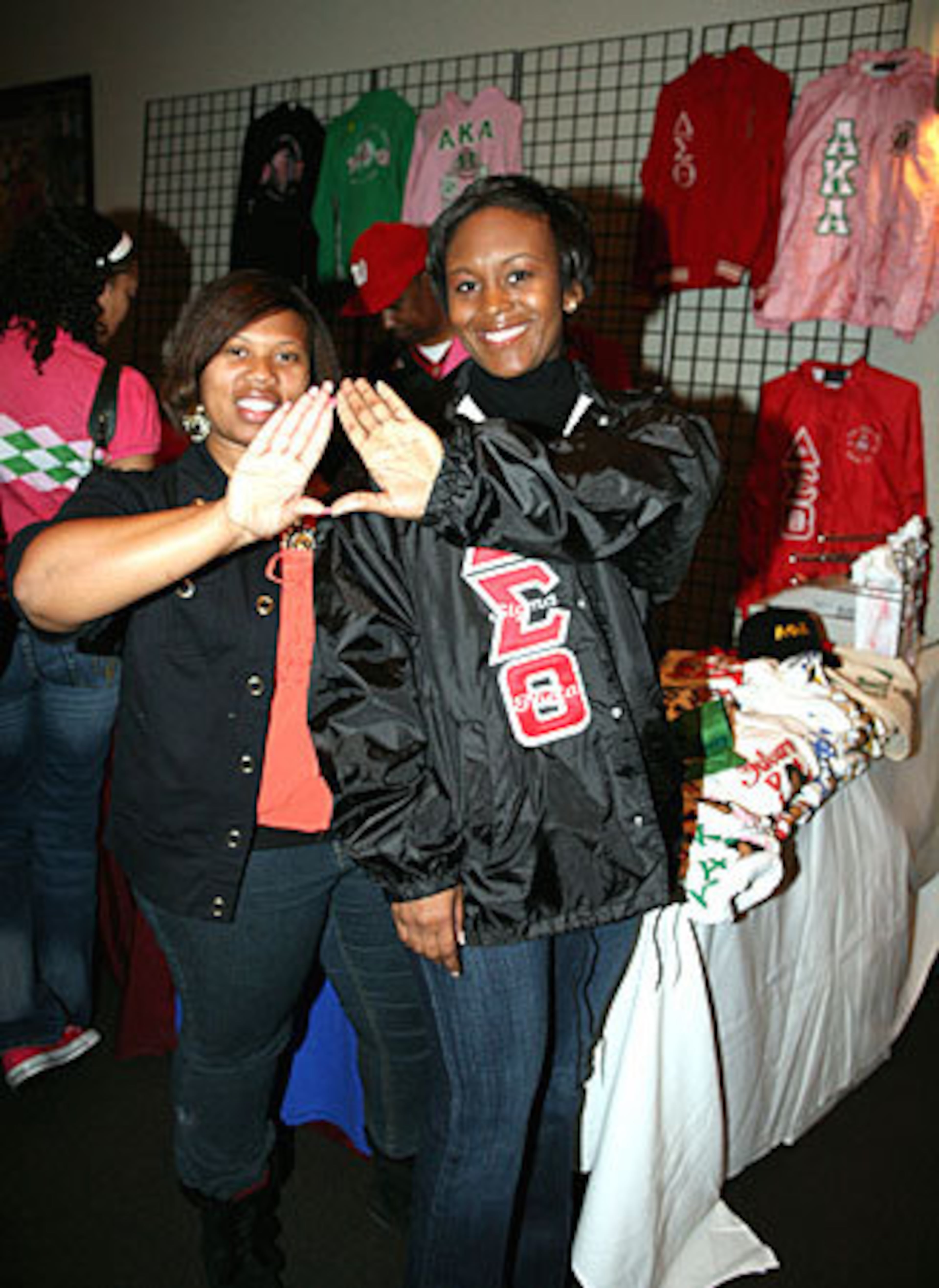 Karis Robinson, left, and LaToya Tolefree purchase Delta Sigma Theta apparel in the Civic Center lobby.