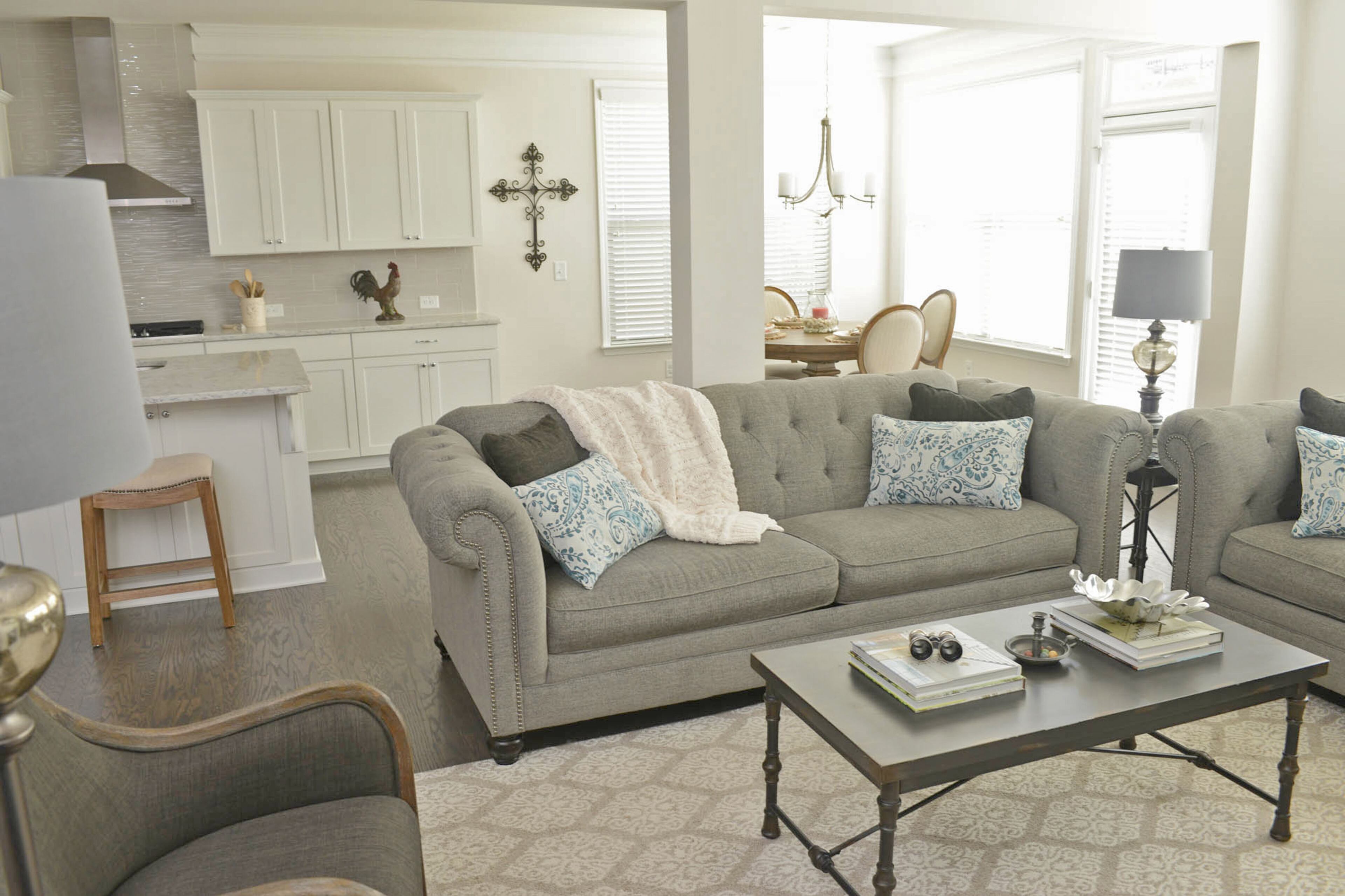 "That whole open space, that's where we spend most of our time," said Matthew. "I'm able to be cooking while she's playing with Zac or vice versa." Couches from Ashley Furniture and chairs from Outrageous Interiors define the living space while leaving it convenient to the kitchen.