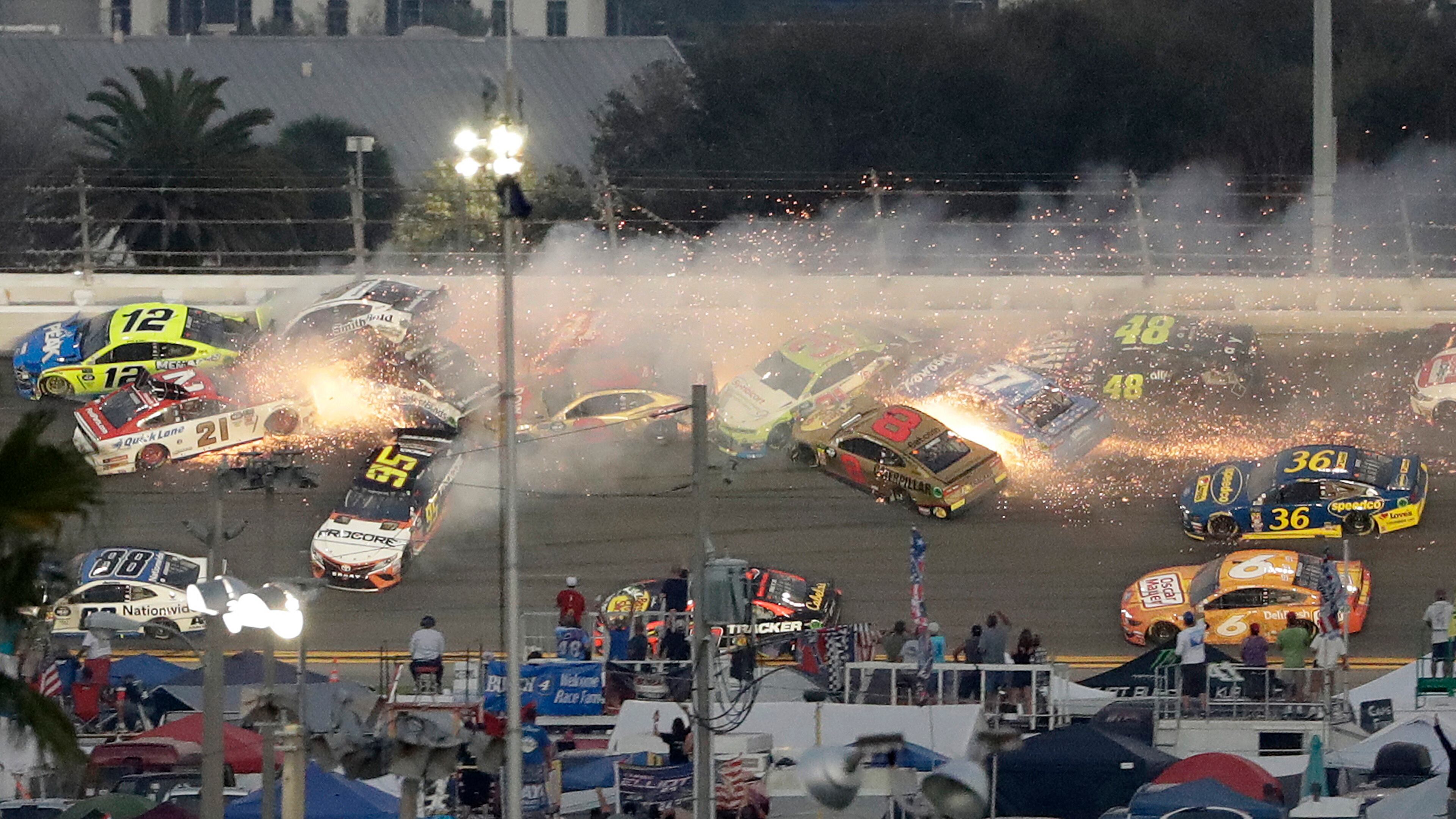 Multiple cars, including Austin Dillon (3), Daniel Suarez (41), David Ragan (38), Paul Menard (21), Ryan Newman (6), Aric Almirola (10), Matt DiBenedetto (95), and Ryan Blaney (12) crash during a NASCAR Daytona 500 Sunday, Feb. 17, 2019, at Daytona International Speedway in Daytona Beach, Fla.