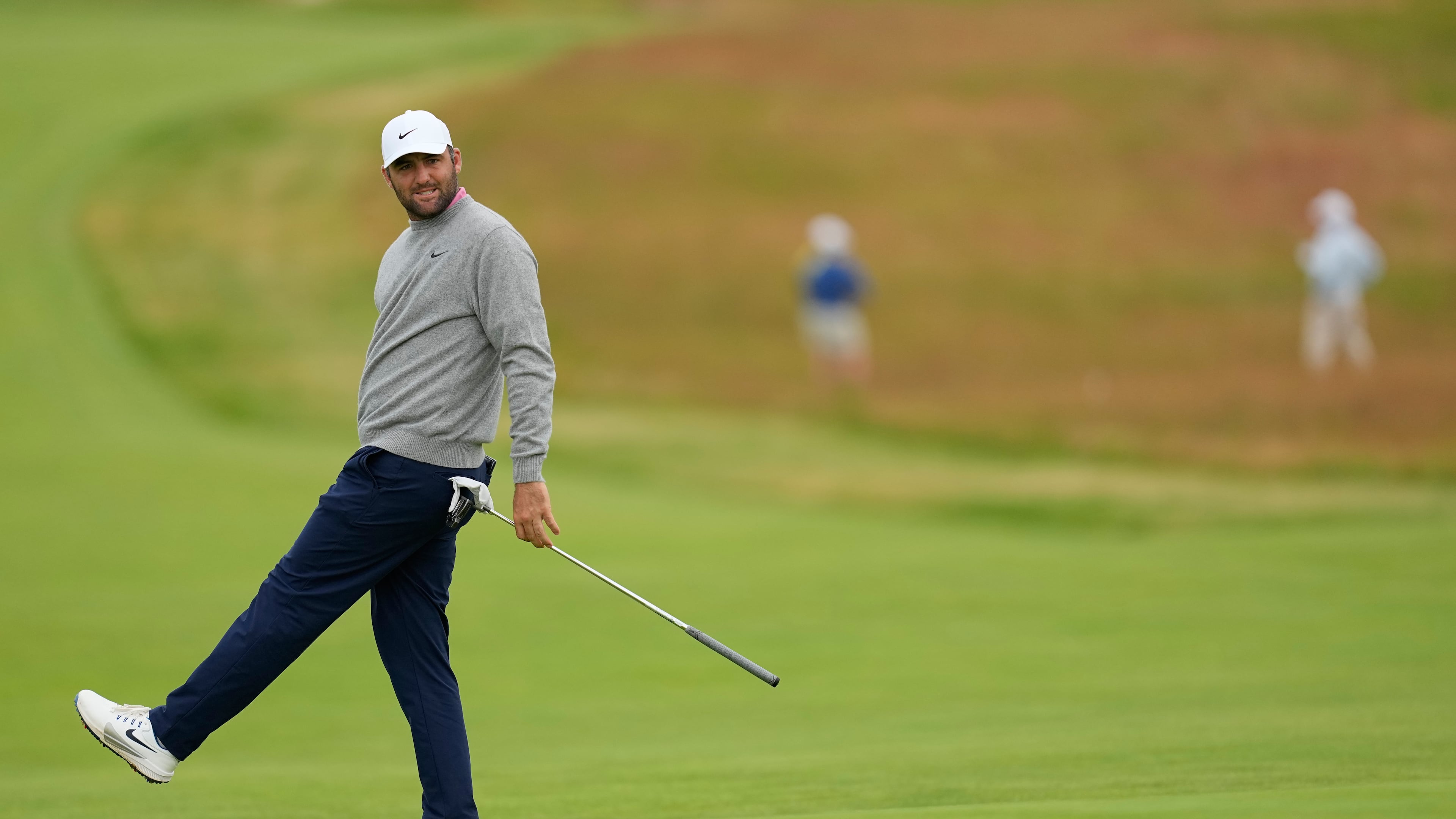 Scottie Scheffler reacts after missing a putt on the third hole during the first round of the U.S. Open golf tournament at Shinnecock Hills Golf Club in Southampton, N.Y., Thursday, June 18, 2026.(AP Photo/David J. Phillip)
