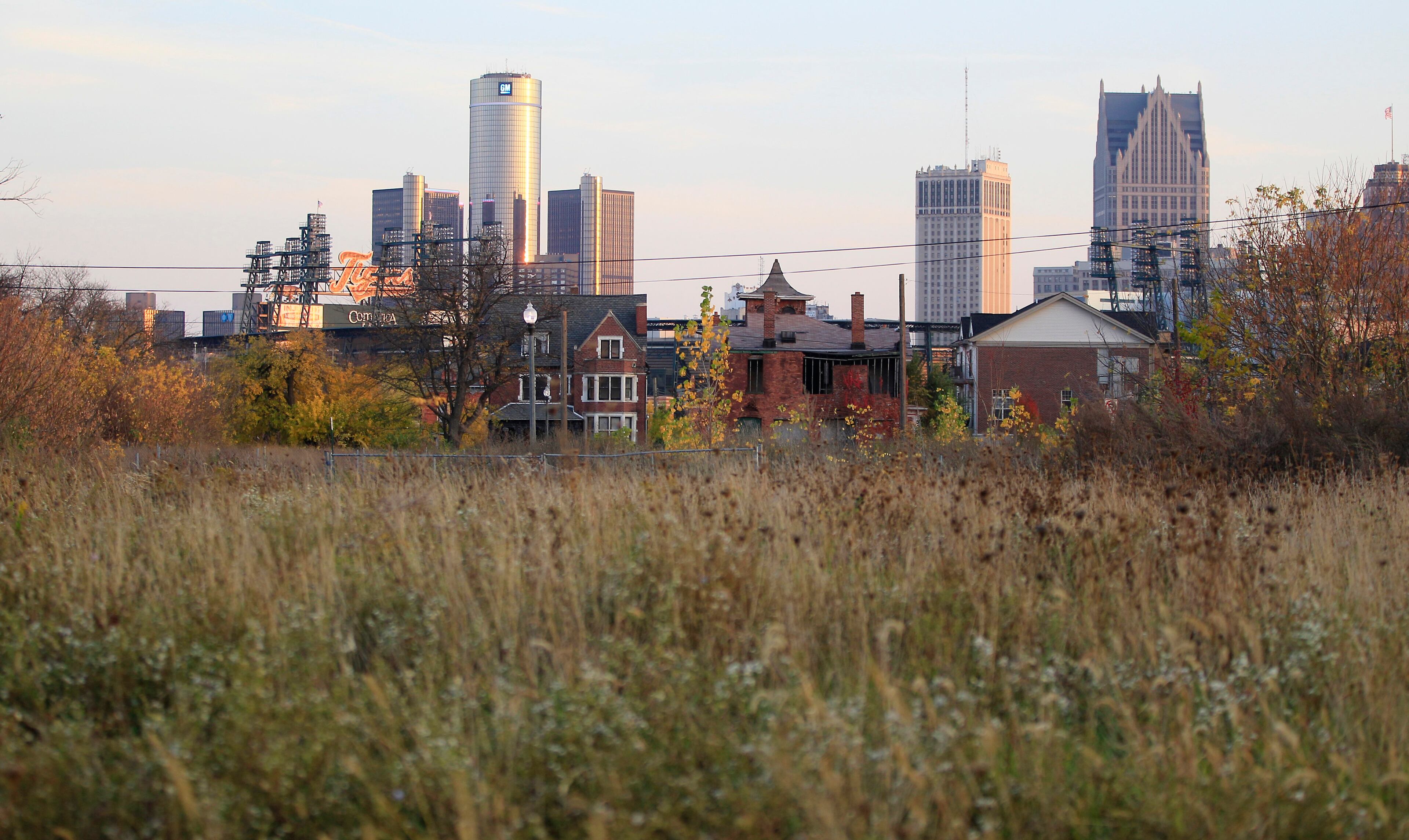 FILE - This Oct. 24, 2012 file photo shows an empty field north of Detroit's downtown. Detroit, which on Thursday, July 18, 2013, filed the largest municipal bankruptcy case in American history, owes as much as $20 billion to banks, bondholders and pension funds. The city can get rid of its gargantuan debt, but a bankruptcy judge can’t bring back residents or raise its dwindling revenue. (AP Photo/Carlos Osorio, File)