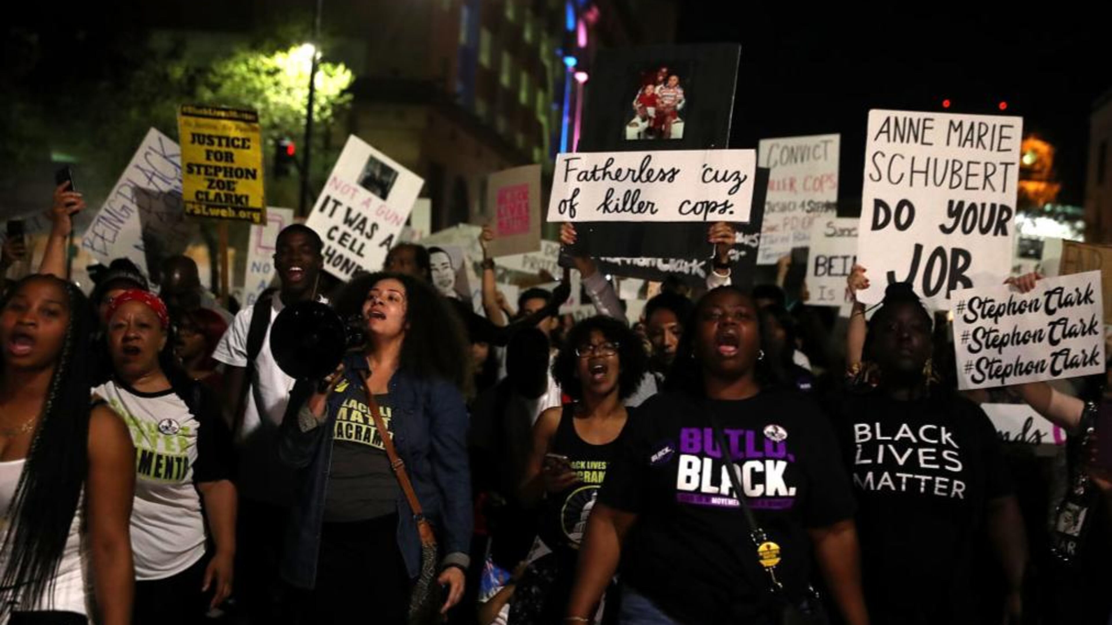 Citizens carried signs during a vigil for Stephon Clark.