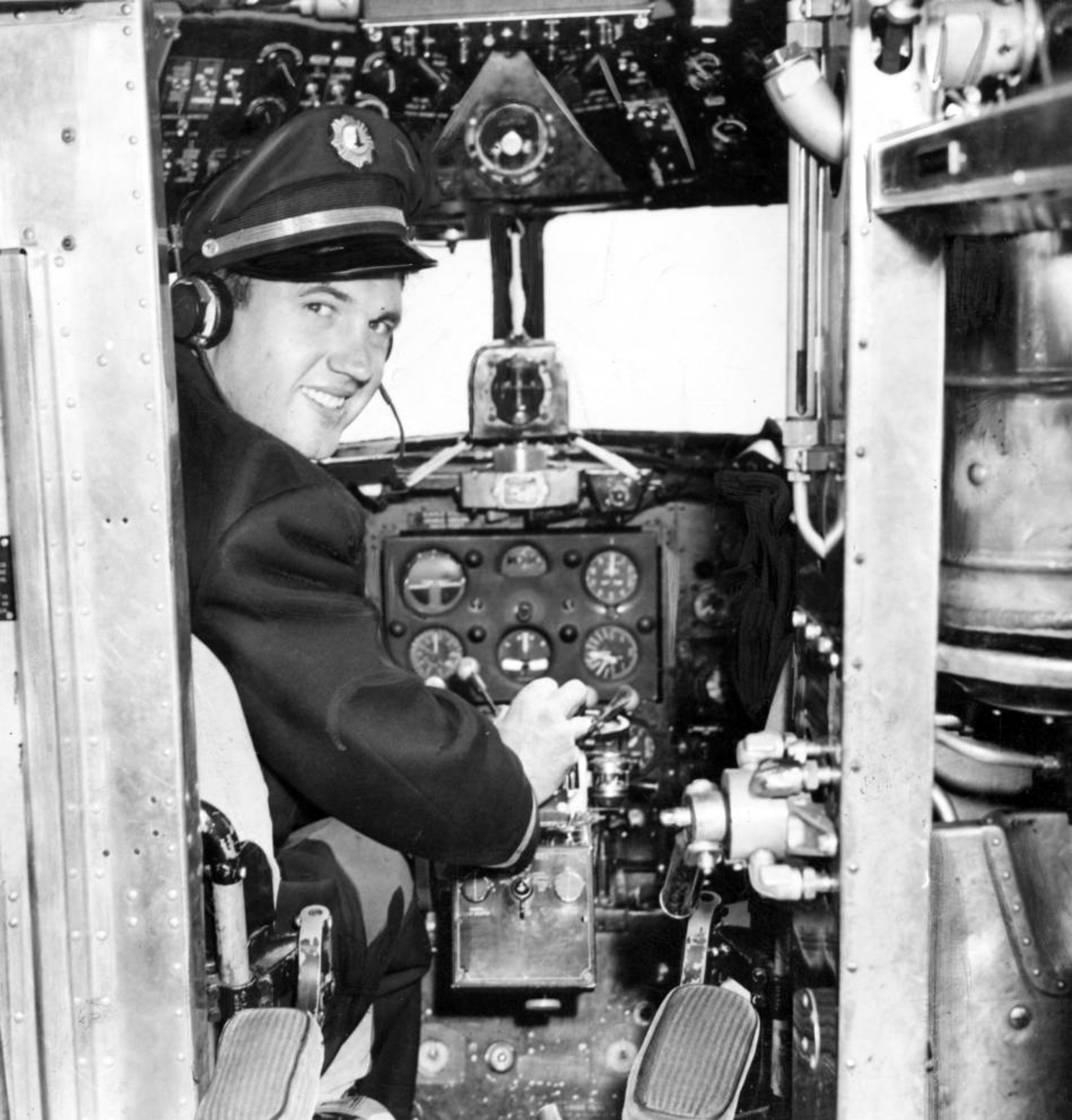 Pilot Johnny Bulla in the cockpit of the Eastern Air Lines plane he flies between Atlanta and Chicago. Photo taken in October 1944.
