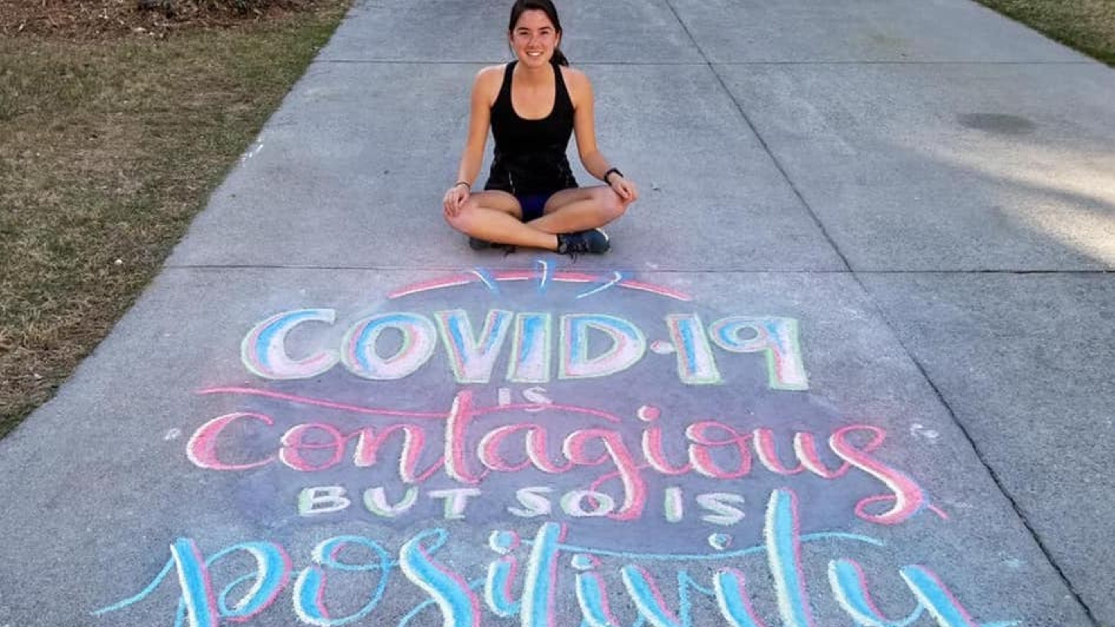 Joyce Wilmot with her chalk art entry to win one of Suwanee's 2020 Spring Break T-shirts. (Courtesy City of Suwanee)