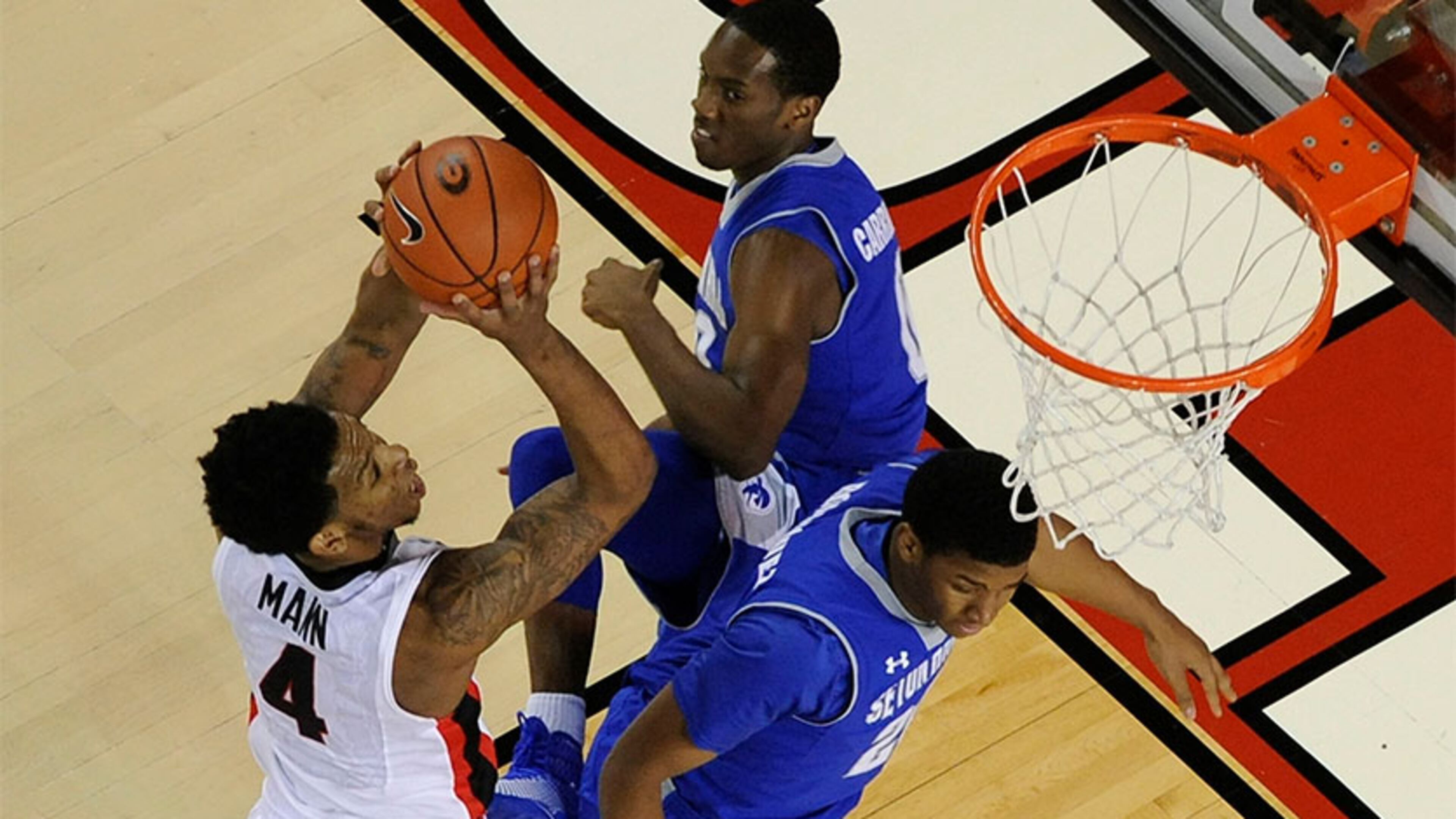 Georgia's Charles Mann scored 7 points as the Bulldogs ran their Big East visitors out of the gym on the way to a 65-47 victory at Stegeman Coliseum.
