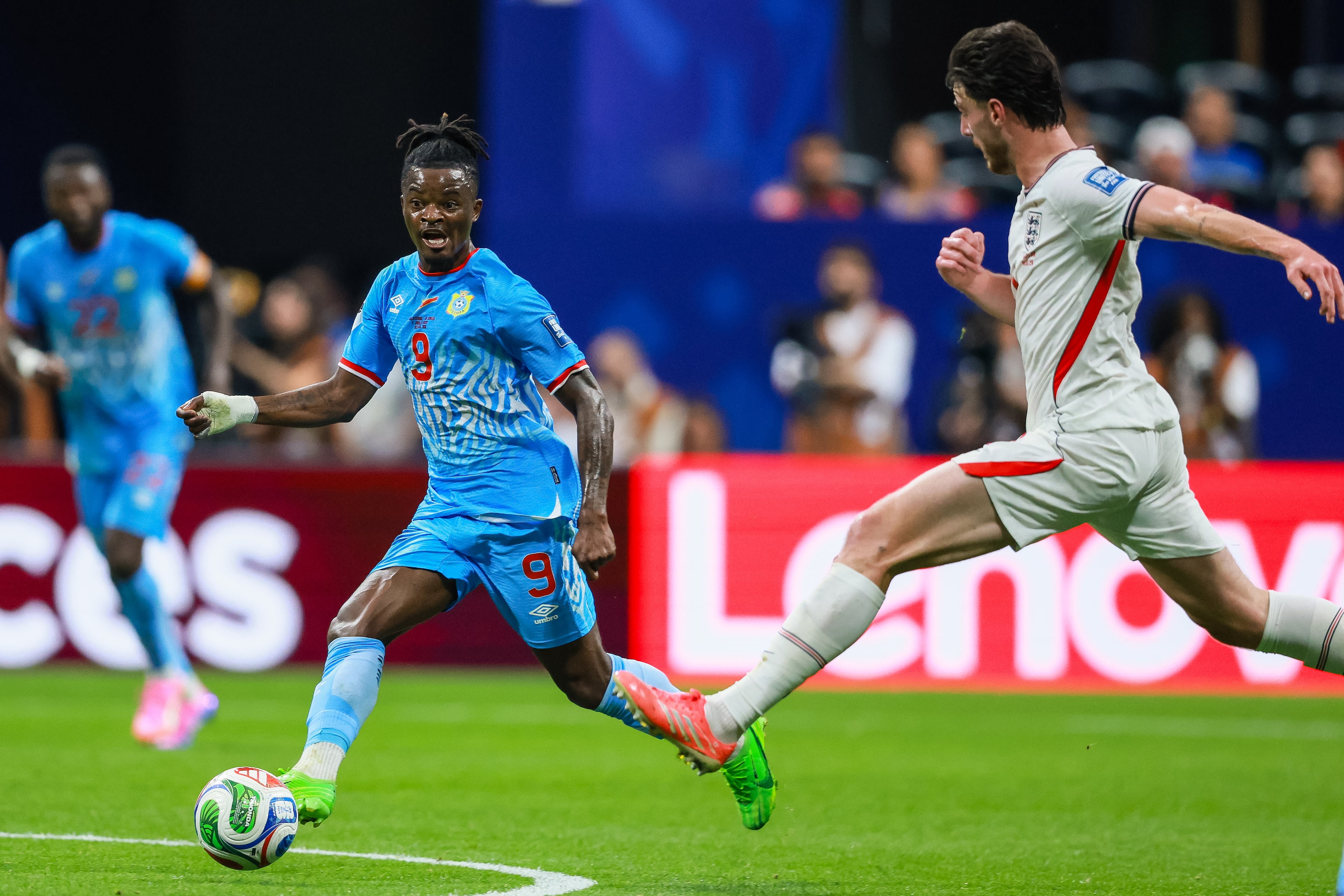 Congo forward Brian Cipenga (center) passes the ball past England midfielder Declan Rice (right) during the first half of a FIFA World Cup round of 32 match at Atlanta Stadium (Mercedes-Benz Stadium) on Wednesday, July 1, 2026, in Atlanta. (Jason Getz/AJC)