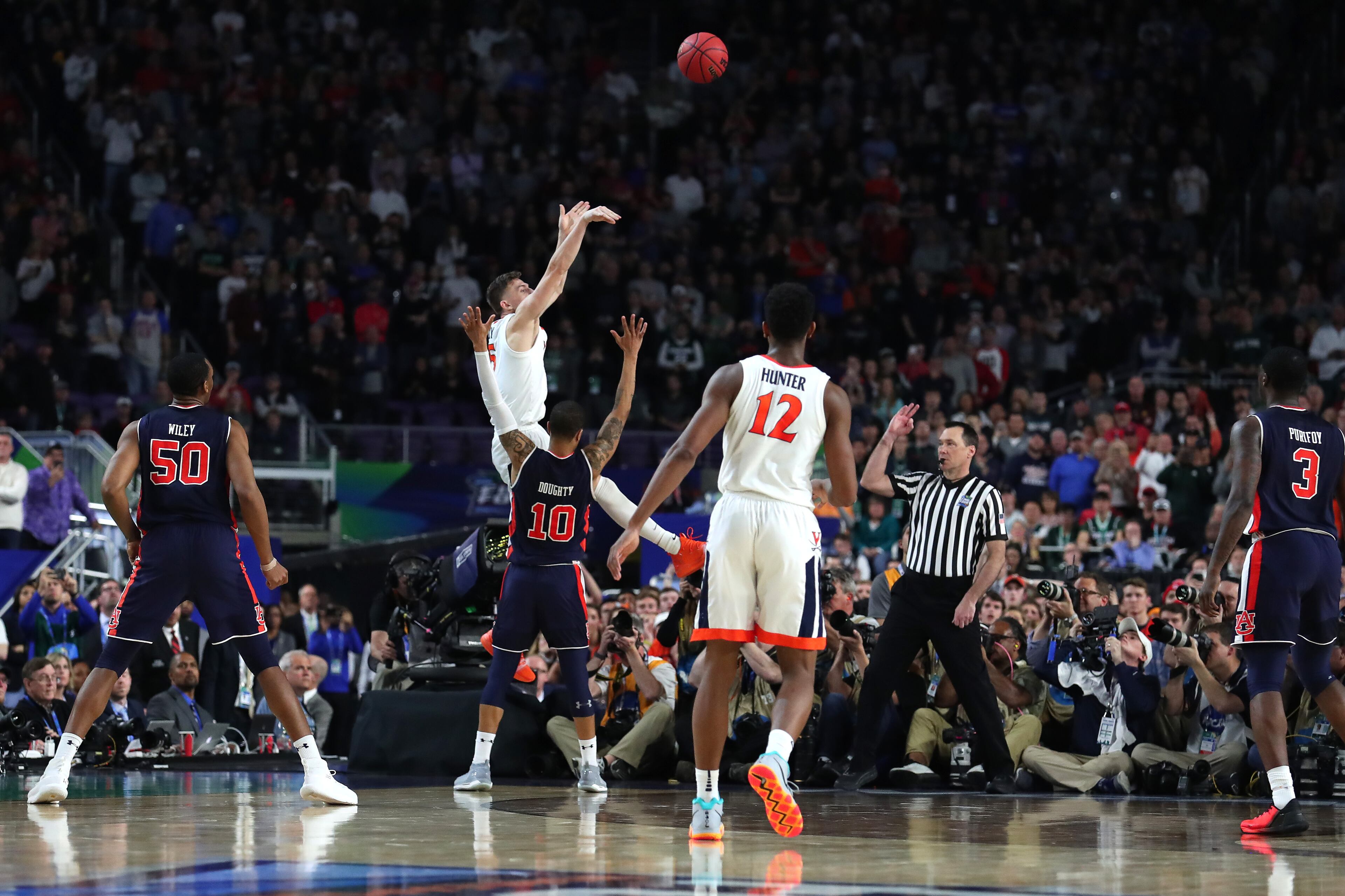 With his team down by two points, Kyle Guy of Virginia attempted a three-pointer as time expired. A foul was called on Auburn's Samir Doughty. Guy made all three free throws and the Cavs advanced to the national championship game. (Photo by Tom Pennington/Getty Images)