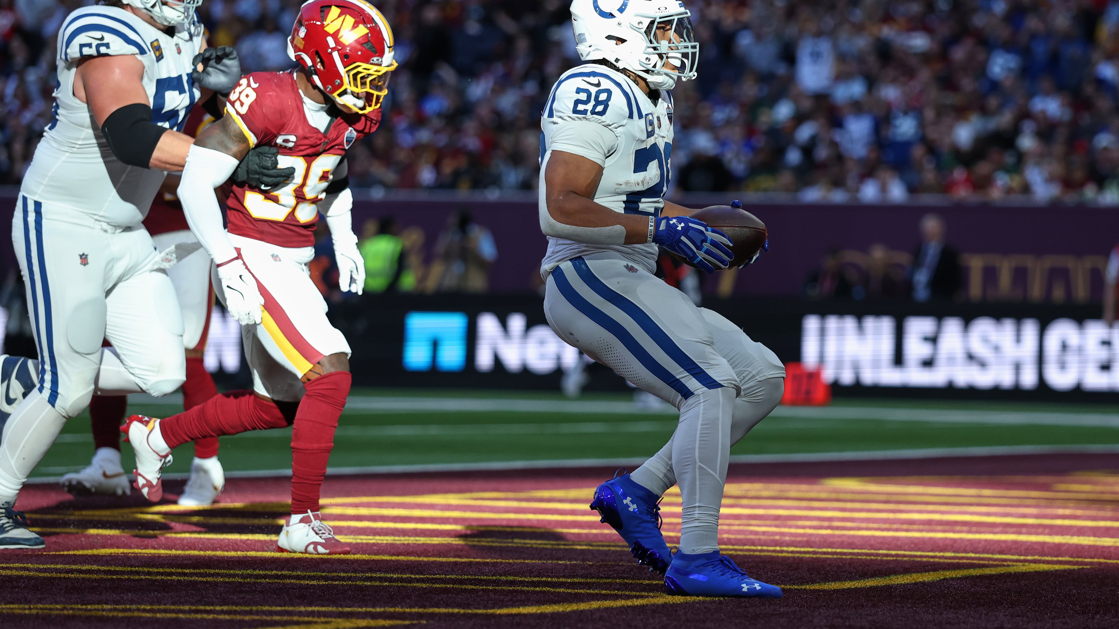 Indianapolis Colts running back Jonathan Taylor (28) celebrates after scoring his side's second touchdown during an NFL football game against Washington Commanders in London, Sunday, Oct. 4, 2026. (AP Photo/Ian Walton)