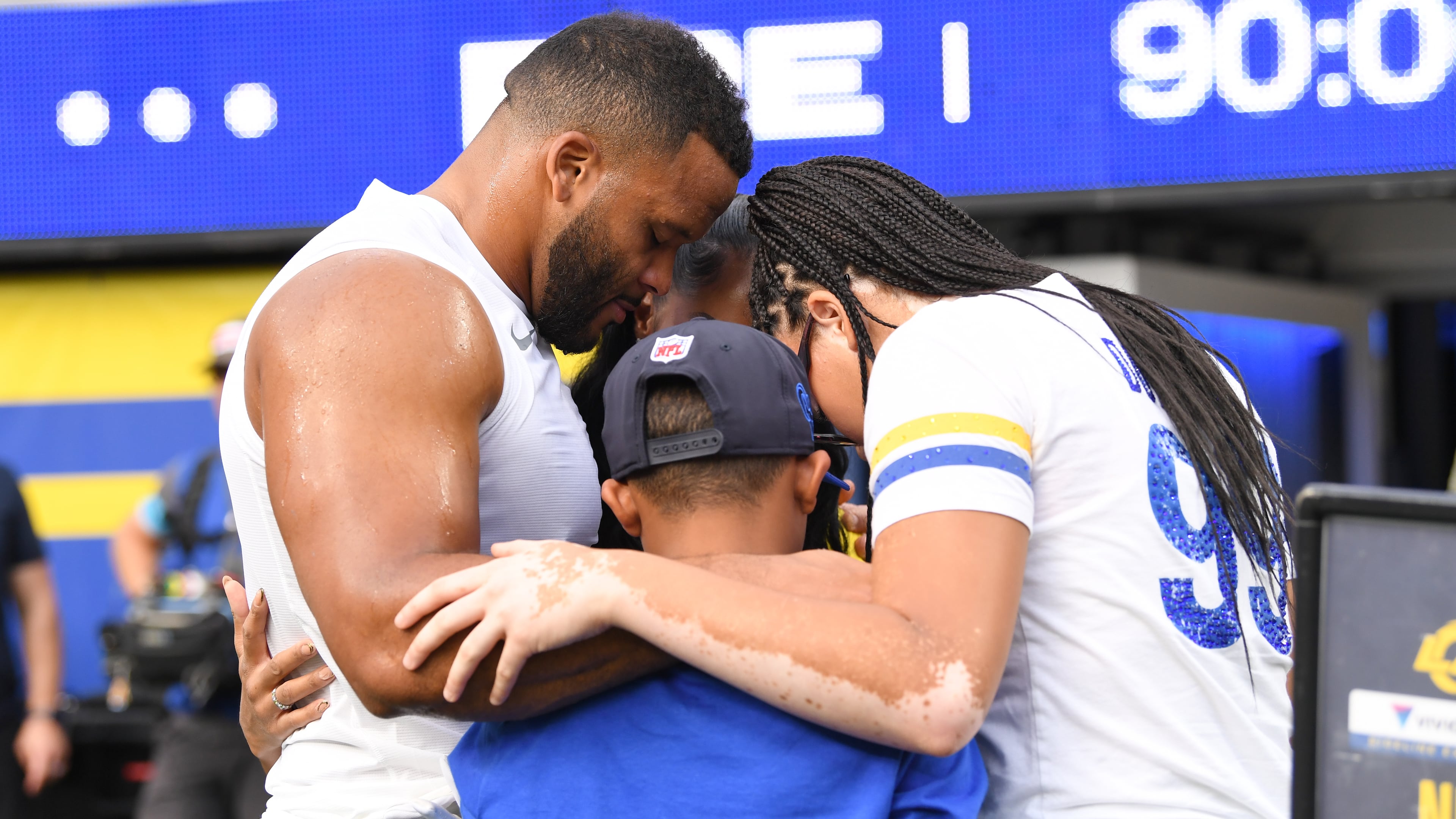 Los Angeles Rams defensive end Aaron Donald huddles with his family before an NFL football game against the New York Giants in Inglewood, Calif., Monday, Sept. 21, 2026. (AP Photo/Katie Chin)