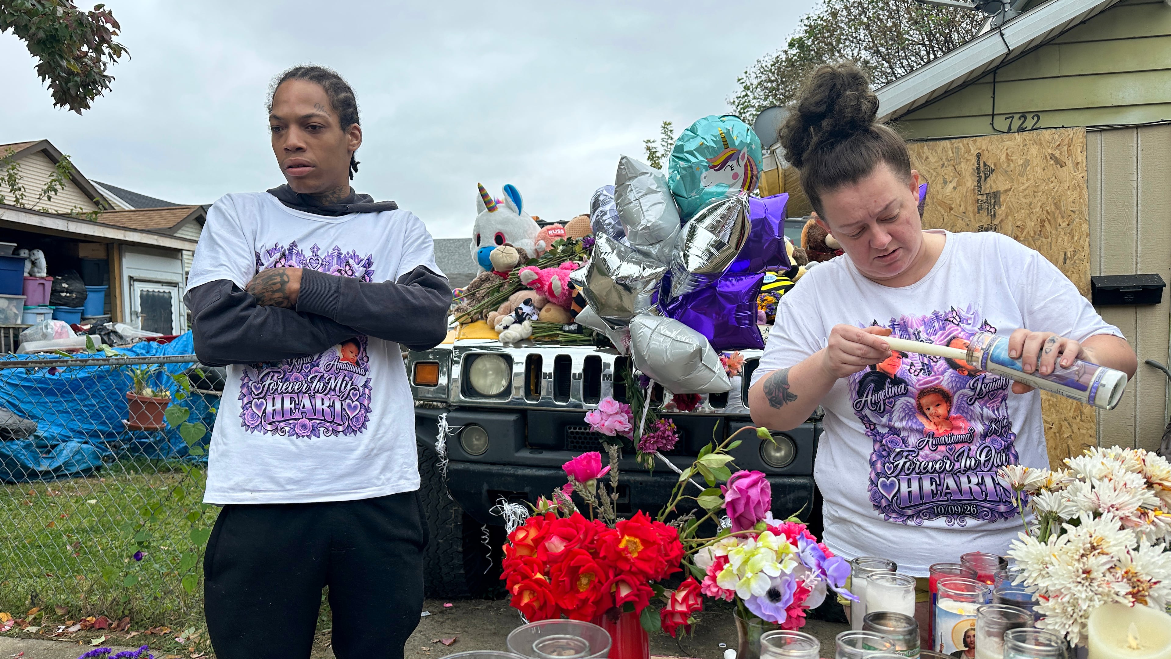 Julius Windham visits a memorial outside the home where authorities say a gunman killed multiple people, including Windham's daughter, in Erie, Pa., on Sunday, Oct. 11, 2026. (AP Photo/Ted Shaffrey)