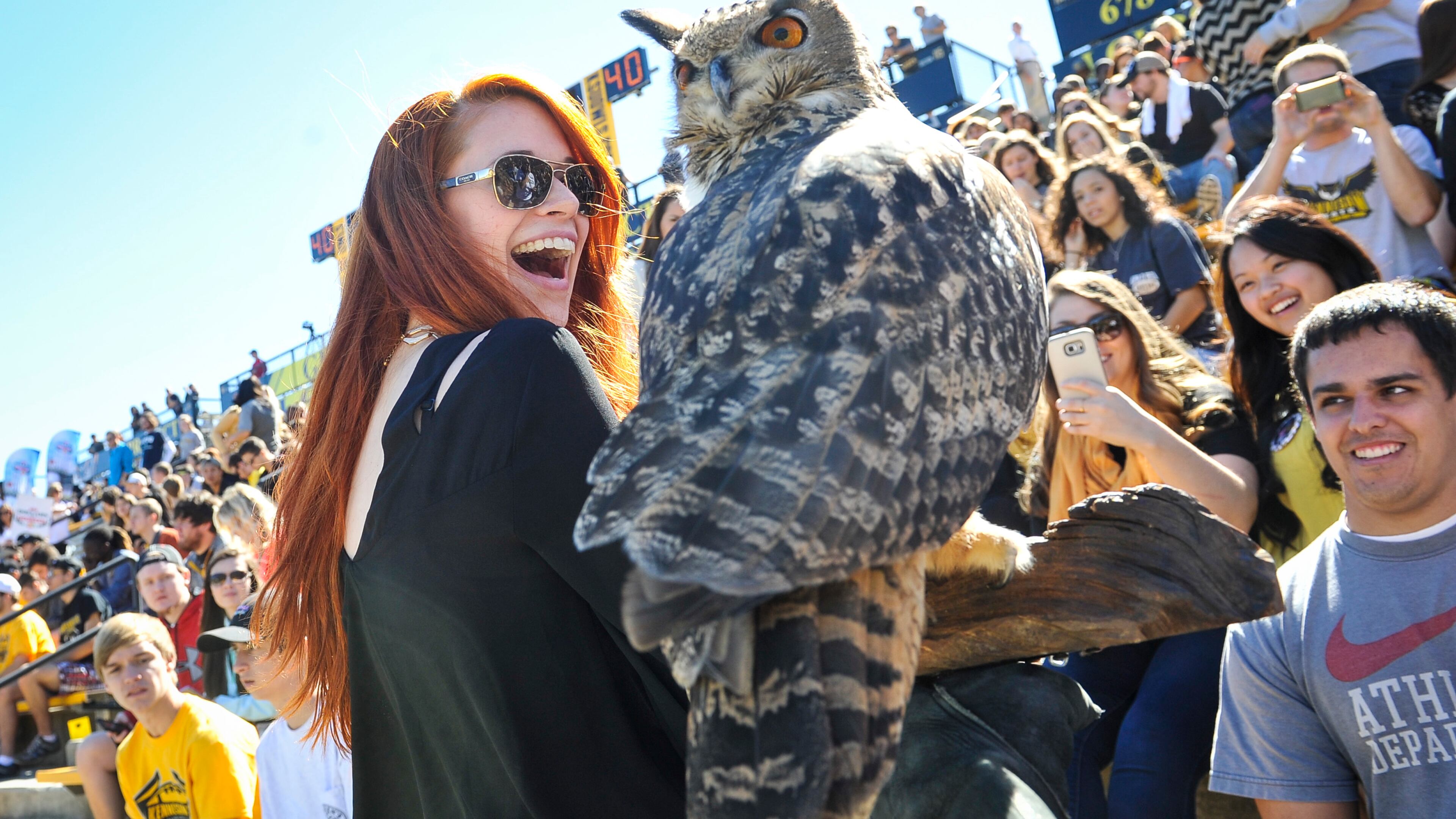 Kennesaw State student Kimberly Panik reacts to the school’s mascot, an owl named Sturgis.