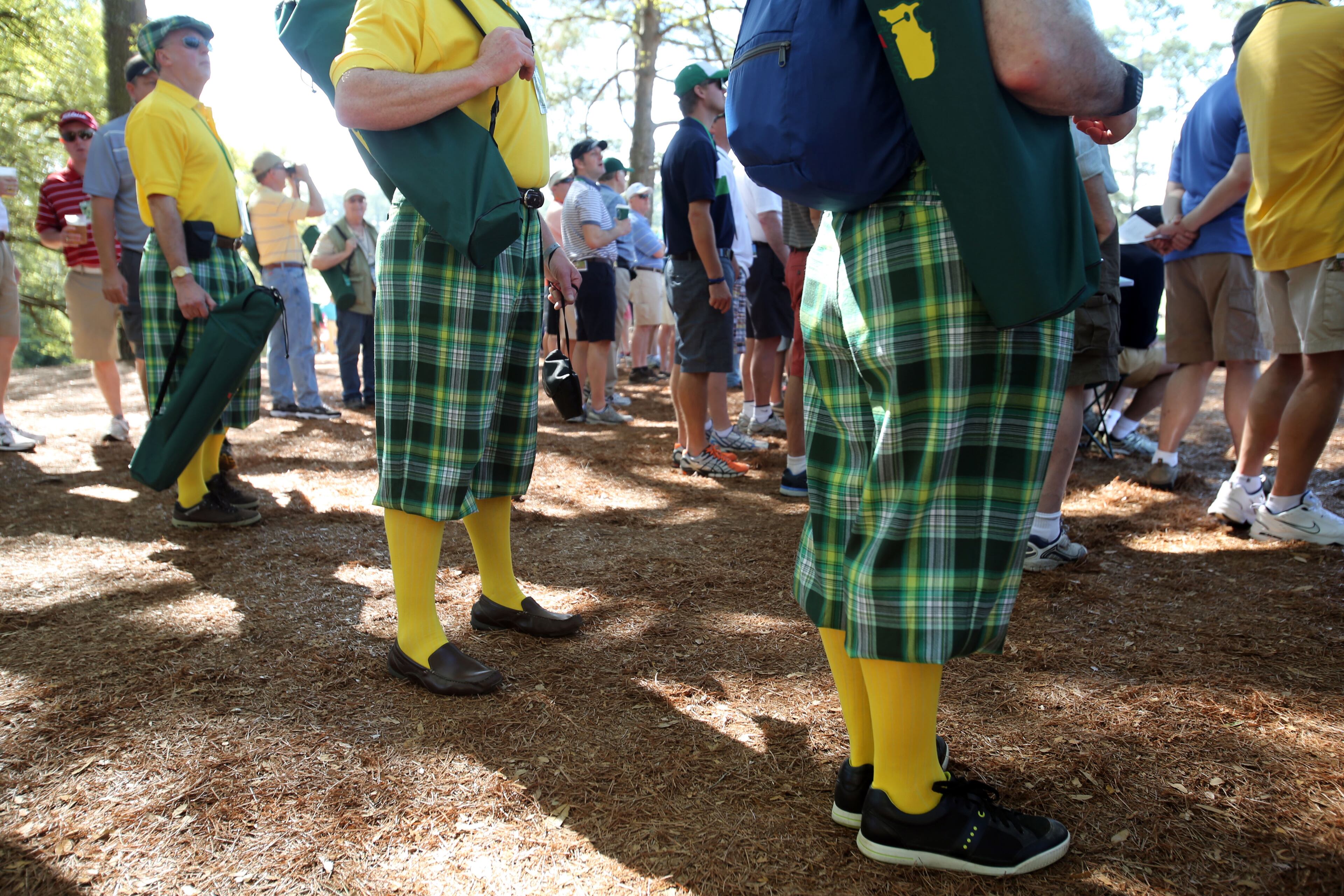 A group of gentlemen from Cardiff, Wales dresses in identical tartan shorts and shirts during the third round in the Masters Tournament at Augusta National Golf Club on Saturday April 13 2013.