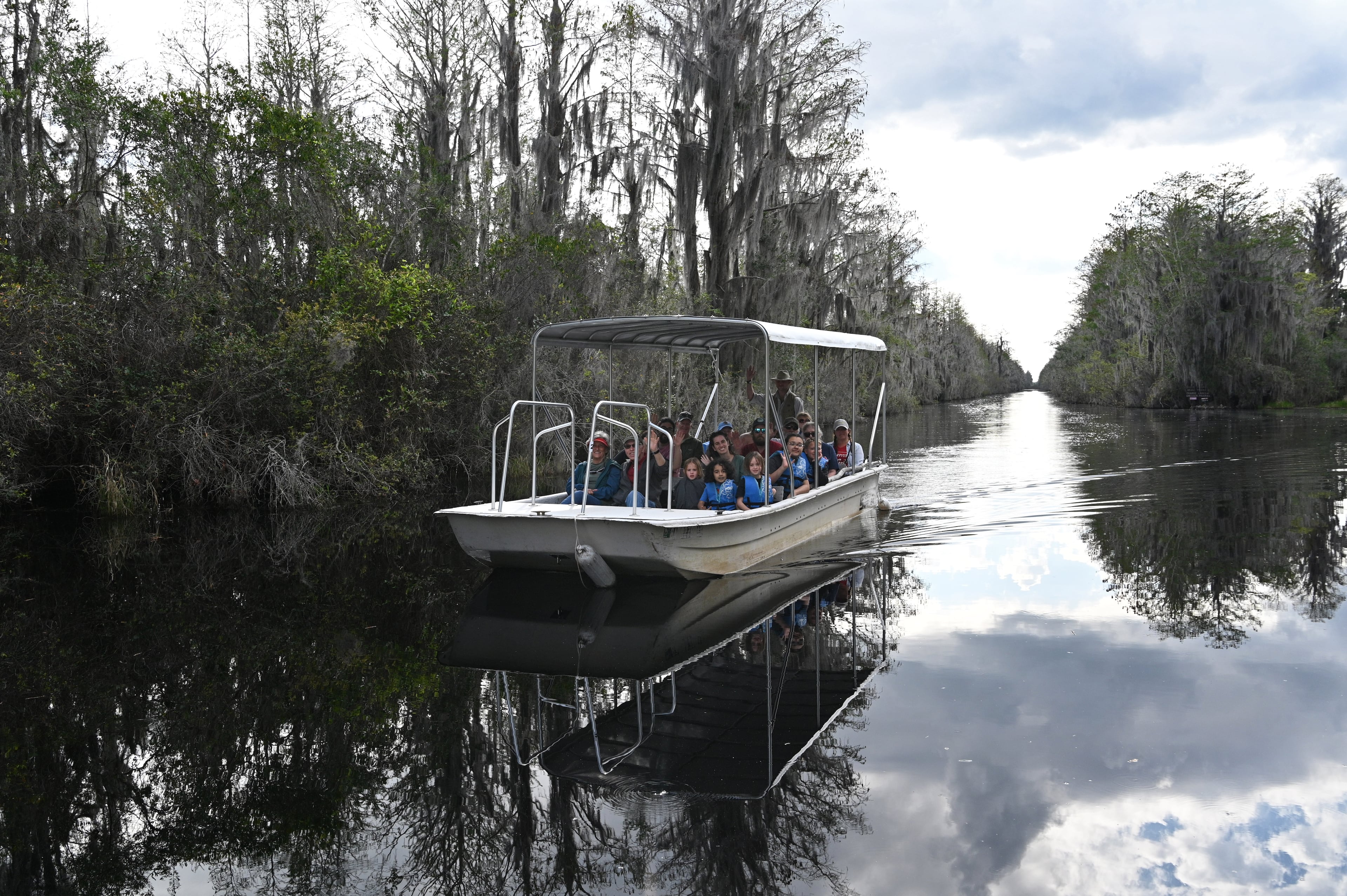 Visitors enjoy a boat tour the Okefenokee Swamp, Monday, Mar. 18, 2024, in Folkston. (Hyosub Shin/AJC)