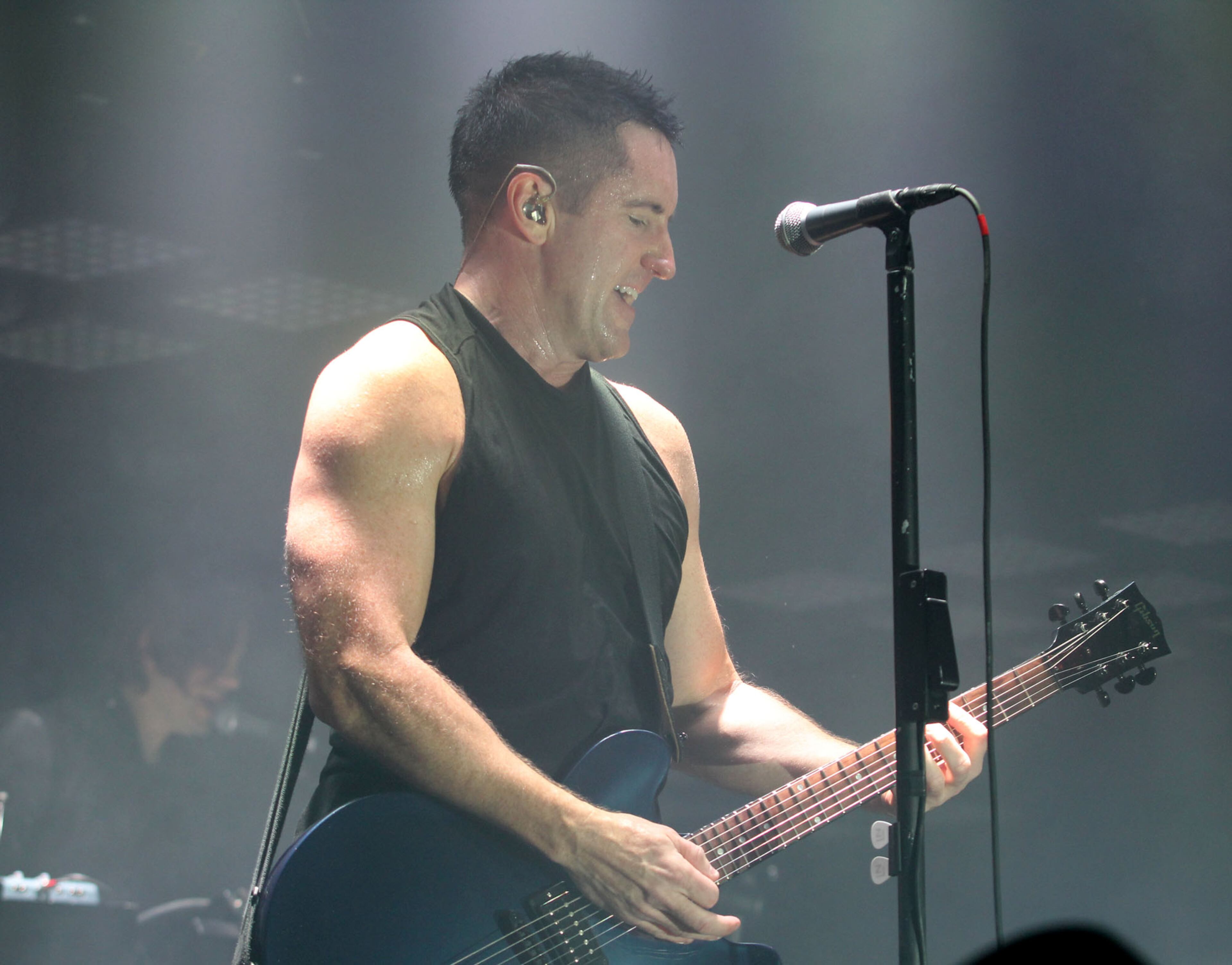 Nine Inch Nails frontman Trent Reznor performs at Philips Arena in Atlanta Thursday, Oct. 24, 2013.