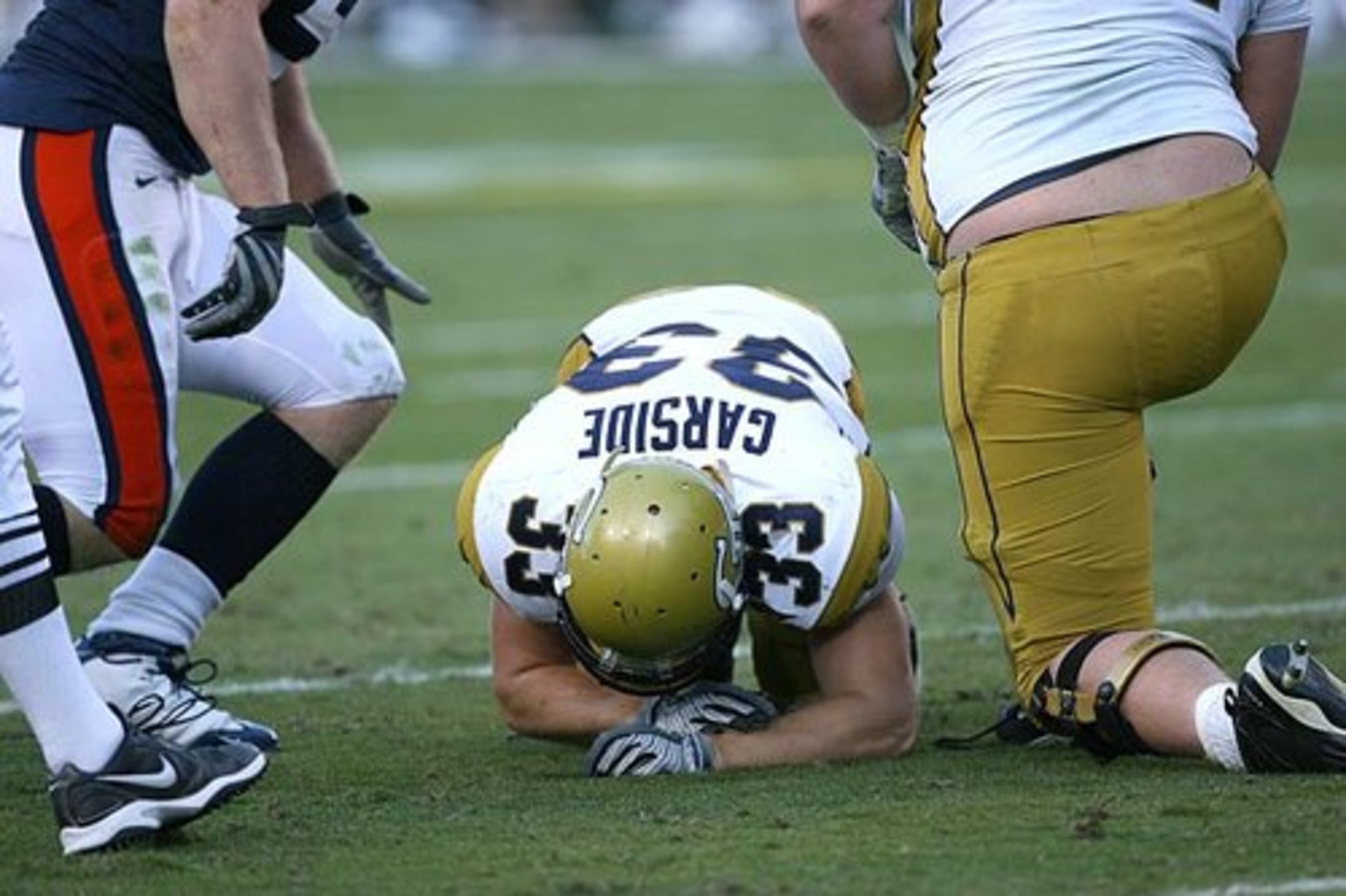 Georgia Tech's Troy Garside stays on the turf after the Yellow Jackets fumbled the ball a second time in the second half.