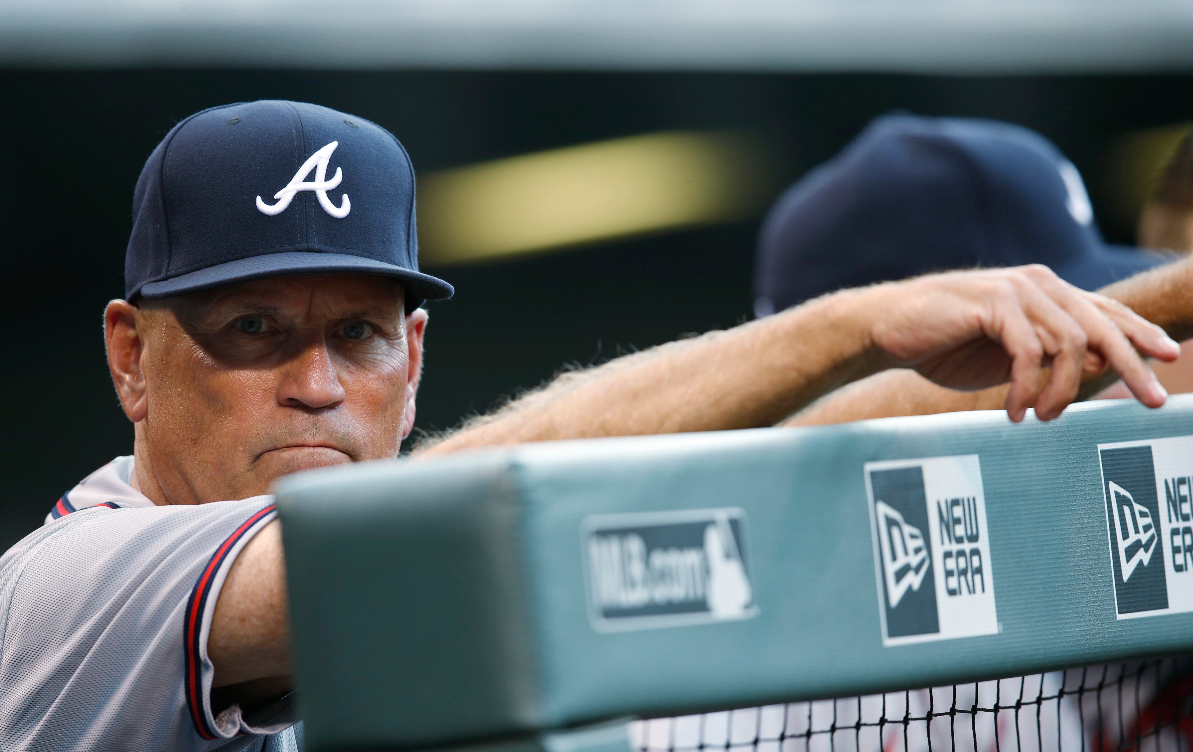 Atlanta Braves interim manager Brian Snitker looks on in the first inning of a baseball game against the Colorado Rockies, Friday, July 22, 2016 in Denver. (AP Photo/David Zalubowski)