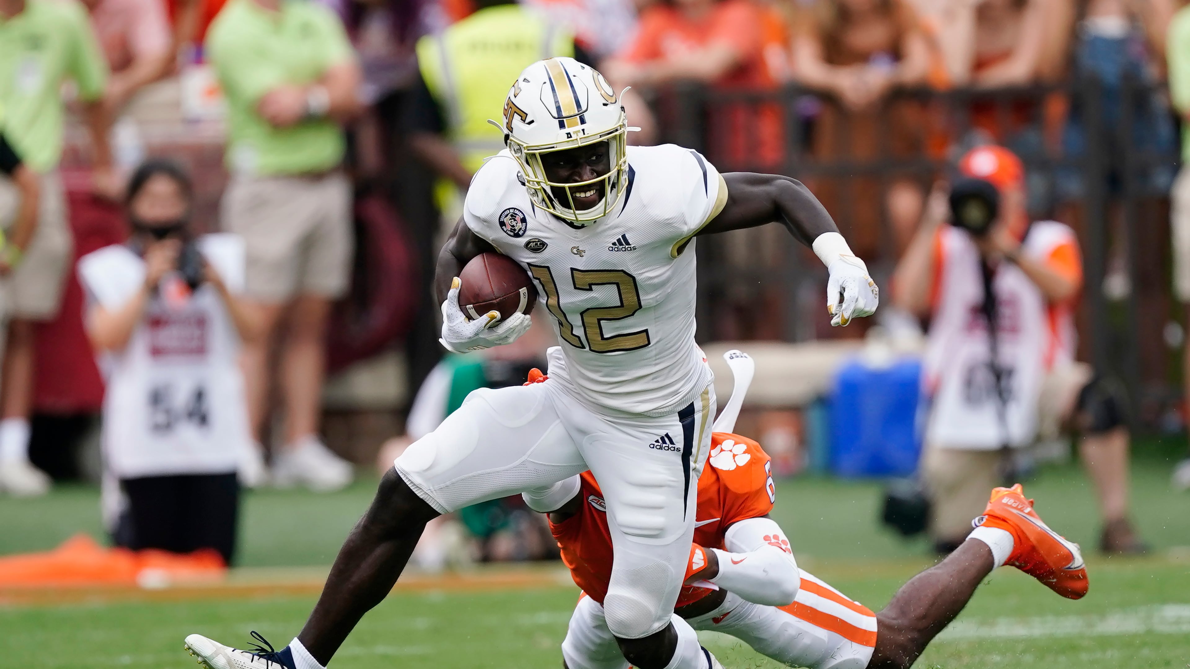 Georgia Tech wide receiver Adonicas Sanders (12) breaks free from Clemson cornerback Sheridan Jones (6) after a catch in the first half of an NCAA college football game, Saturday, Sept. 18, 2021, in Clemson, S.C. (AP Photo/John Bazemore)