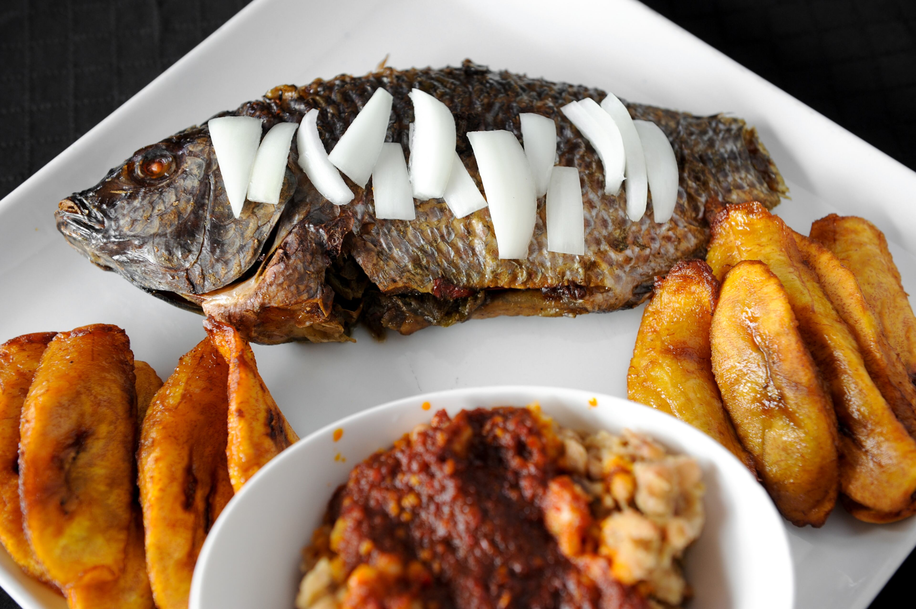 FAD Homeboy Special- beans served with plantains, special beans and pepper sauce with grilled whole fish. (Beckysteinphotography.com)