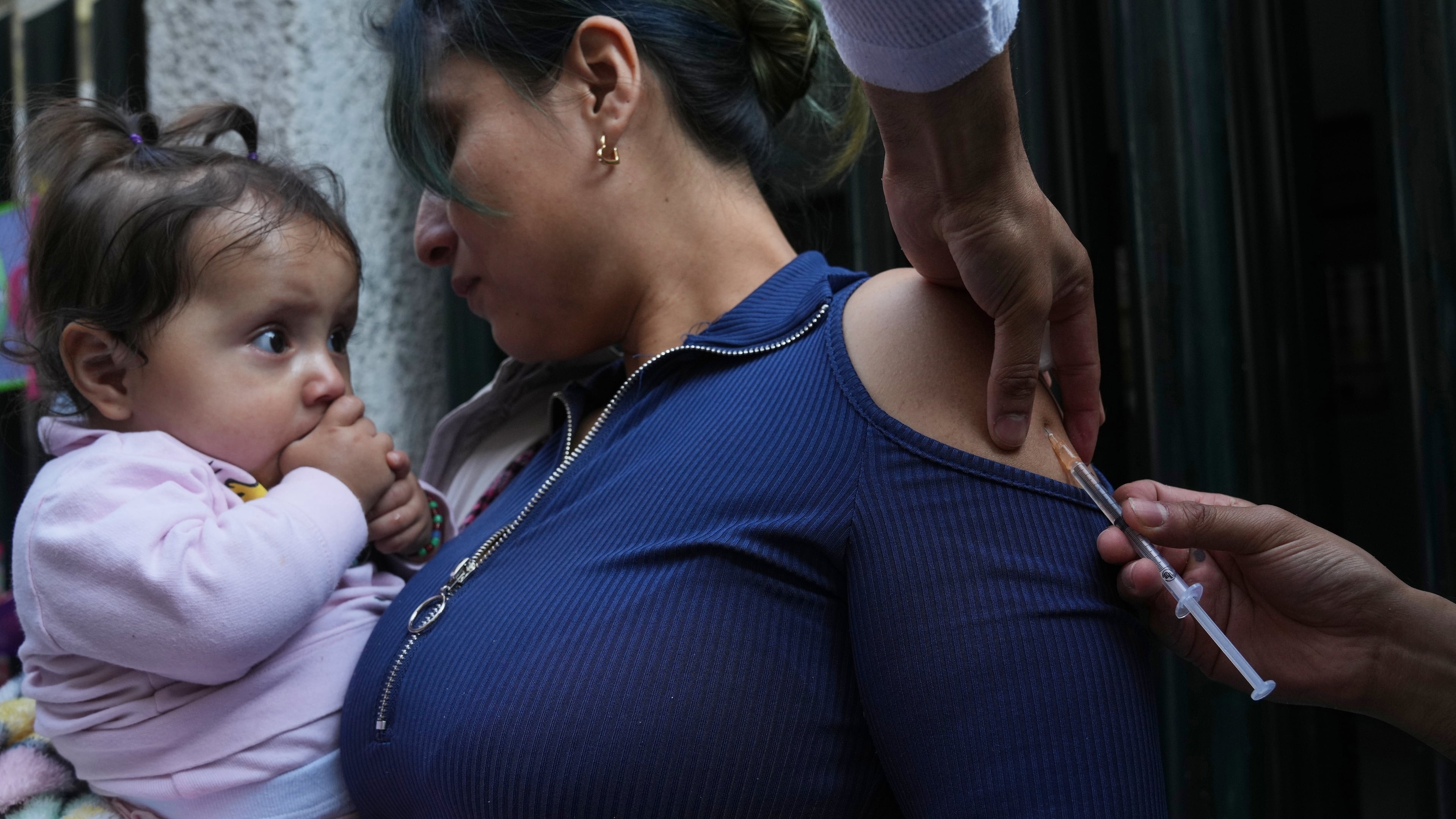 A health worker administers a dose of the measles vaccine outside a public hospital in Mexico City, Wednesday, Feb. 4, 2026. (AP Photo/Marco Ugarte)