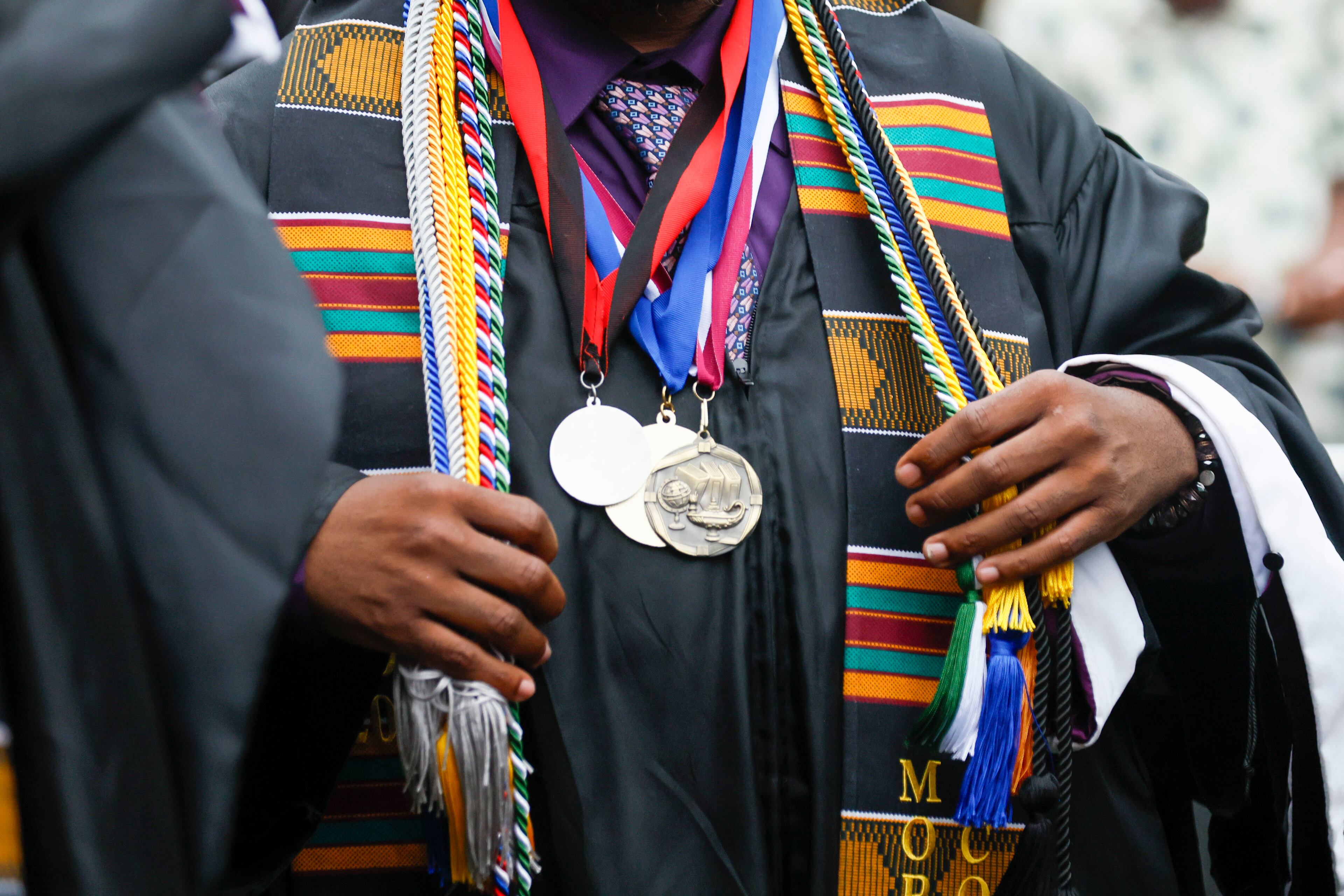 A graduate adjusts his robe at the 141st Commencement Ceremony of Morehouse College on Sunday, May 18, 2025.
(Miguel Martinez/ AJC)