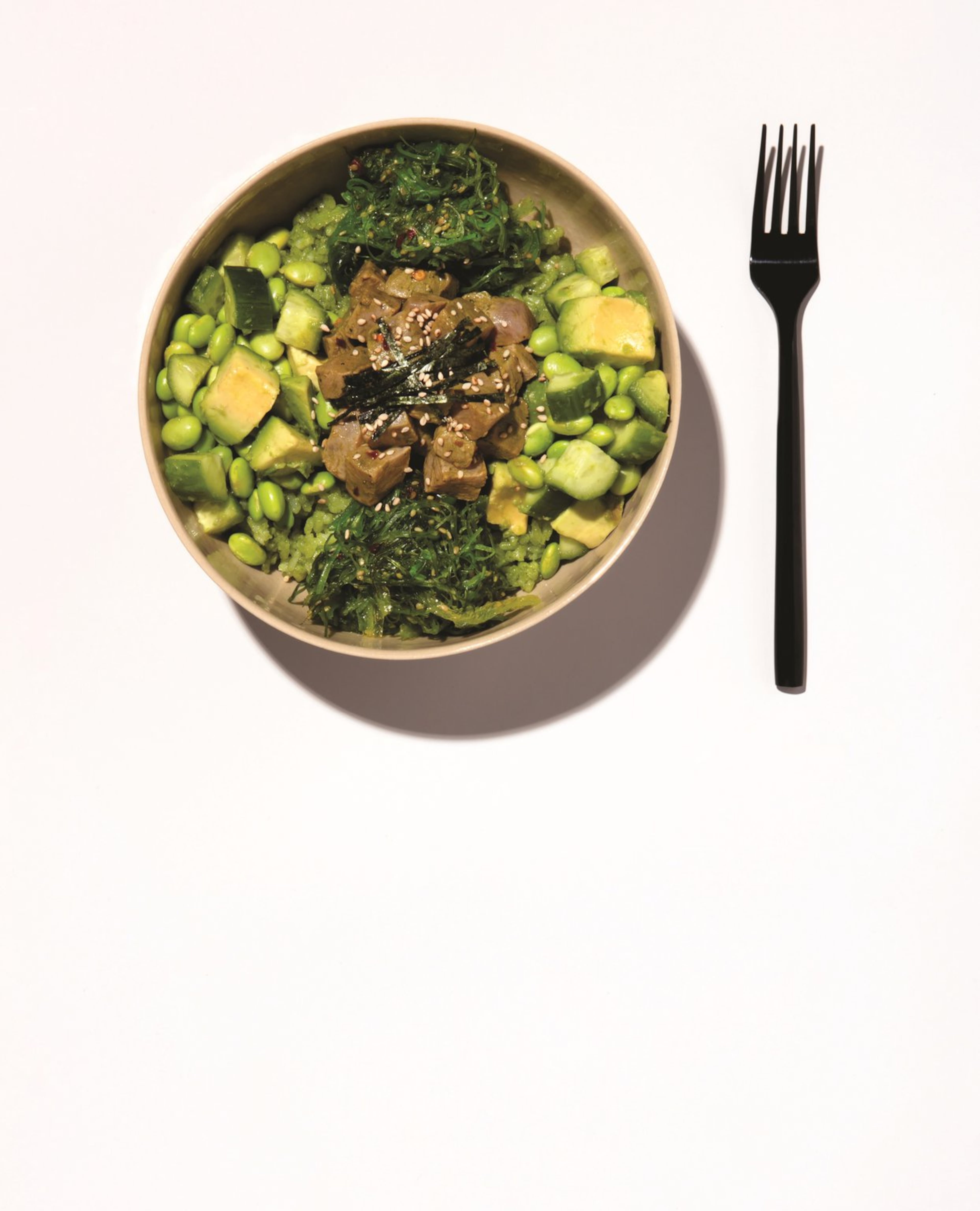 This Tuna Poke Bowl with Matcha Rice is one of the recipes in “Matcha” by Jessica Flint and Anna Kavaliunas (Dovetail, $25). The recipe, created by Ben Mims, combines two delicious food trends, matcha and poke. PHOTO CREDIT: Scott Gordon Bleicher