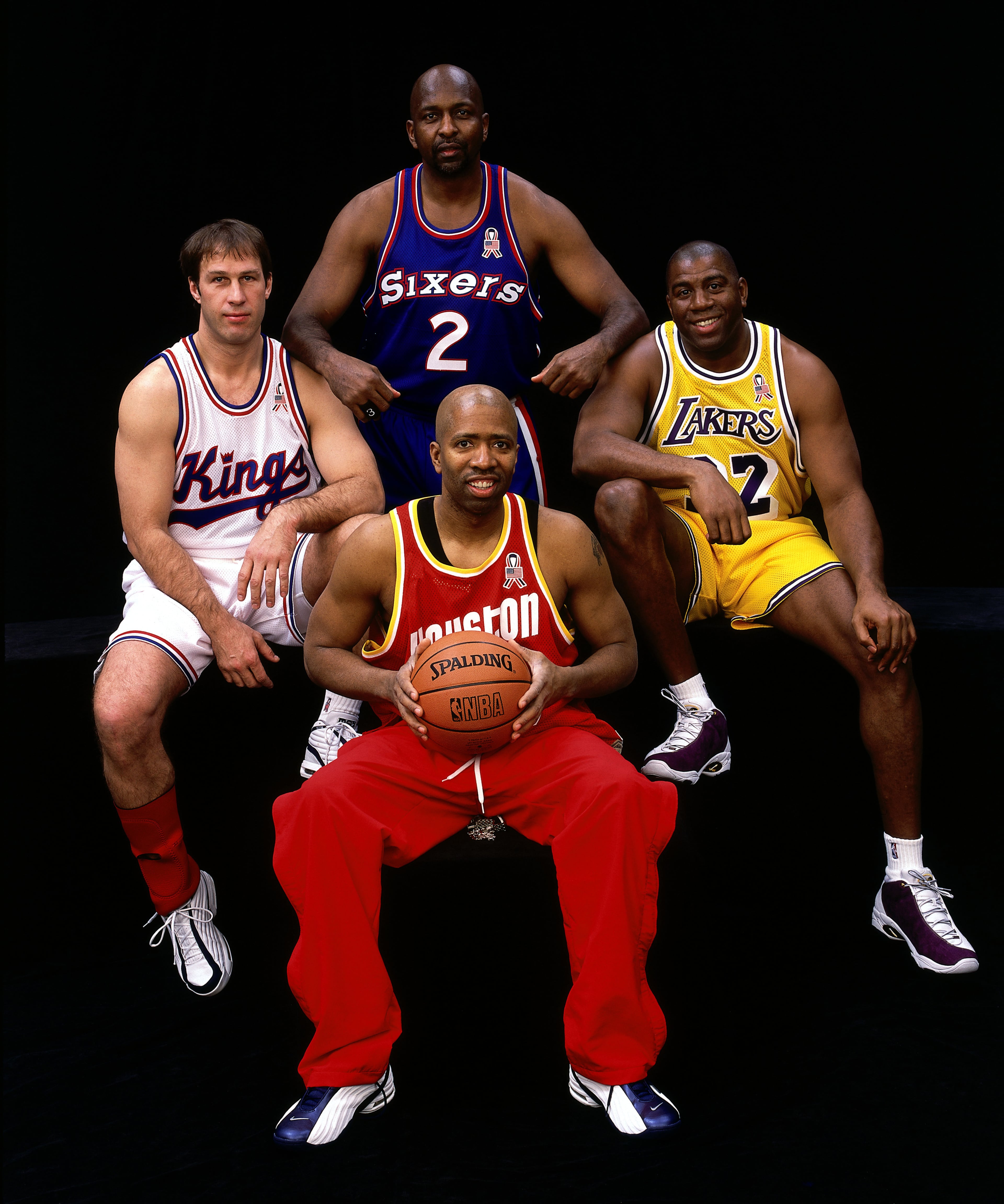 9 Feb 2002: Moses Malone #2, Sarunas Marciulionis, Magic Johnson #32 and Kenny Smith pose for a portrait before the 3 on 3 Celebrity Hoop It Up Challenge during the 2002 NBA All Star Weekend at the First Union Center in Philadelphia, PA. NOTE TO USER: User expressly acknowledges and agrees that, by downloading and/or using this Photograph, User is consenting to the terms and conditions of the Getty Images License Agreement. Mandatory copyright notice: Copyright 2002 NBAE Mandatory credit: Andy Hayt/NBAE/Getty Images