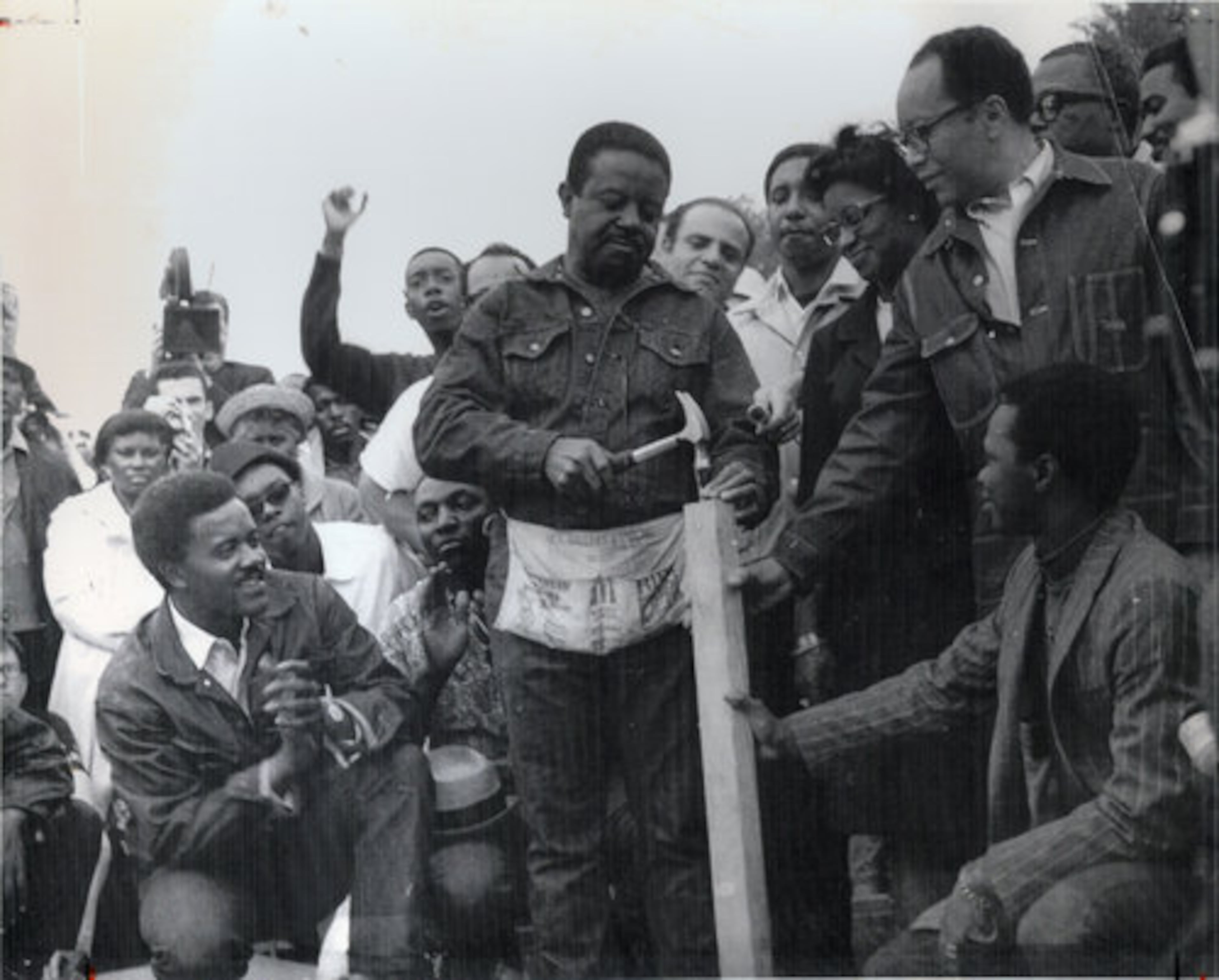 J. T. Johnson (kneeling), Ralph Abernathy (holding hammer), Judge Benjamin Hooks (over Abernathy's shoulder), Bernard Lafayette, Juanita Abernathy, Bill Rutherford, Rev. Al Sampson. Photo courtesy of J. T. Johnson
