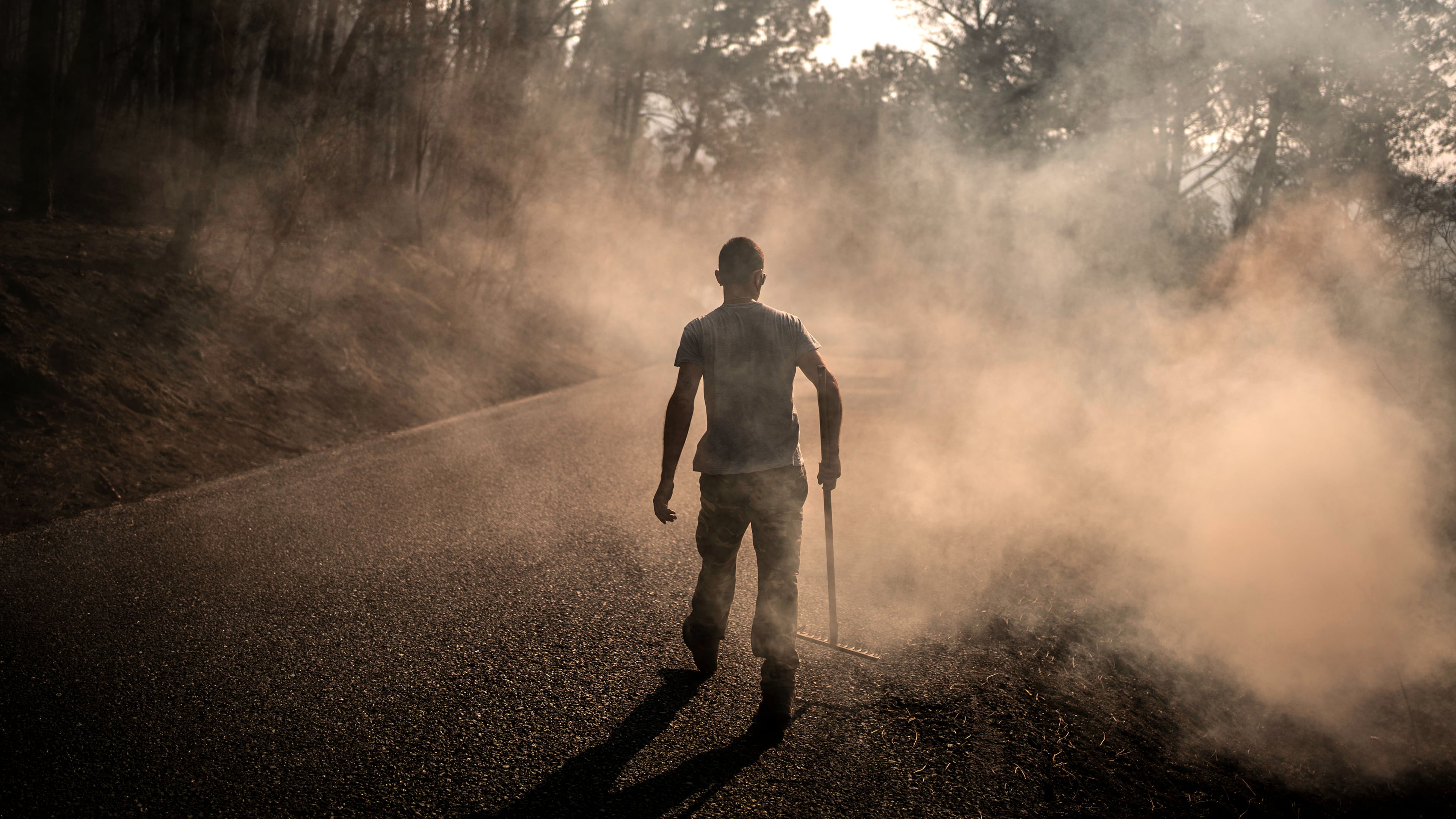 A man works to extinguish hot spots in an area burned by a wildfire near Casavieja, Ávila province, Spain, Wednesday, July 29, 2026. (AP Photo/Olmo Calvo)