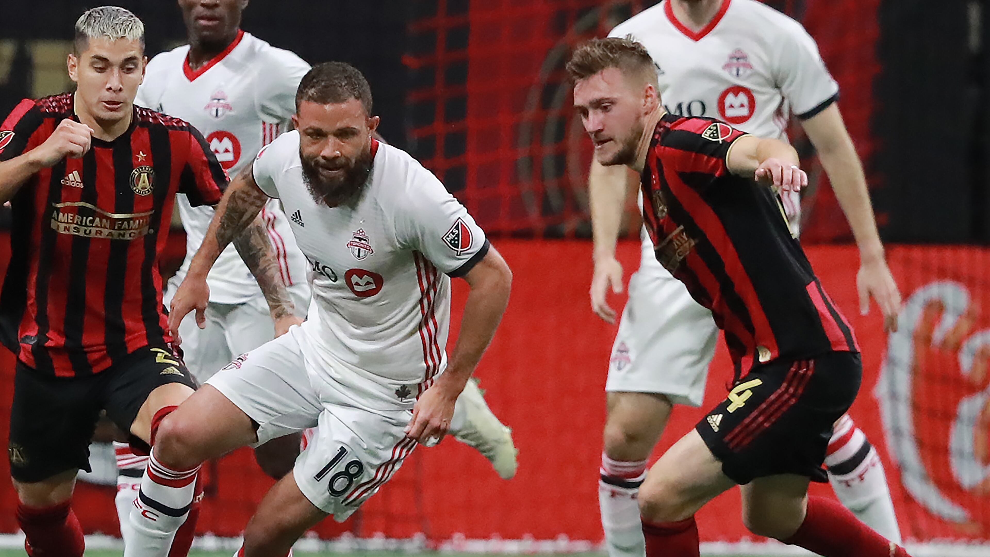 October 30, 2019 Atlanta: Toronto FC midfielder Nick DeLeon takes the ball away from Atlanta United midfielder Julian Gressel (right) and scores the winning goal for a 2-1 victory in the Eastern Conference Final on Wednesday, October 30, 2019, in Atlanta. Curtis Compton/ccompton@ajc.com