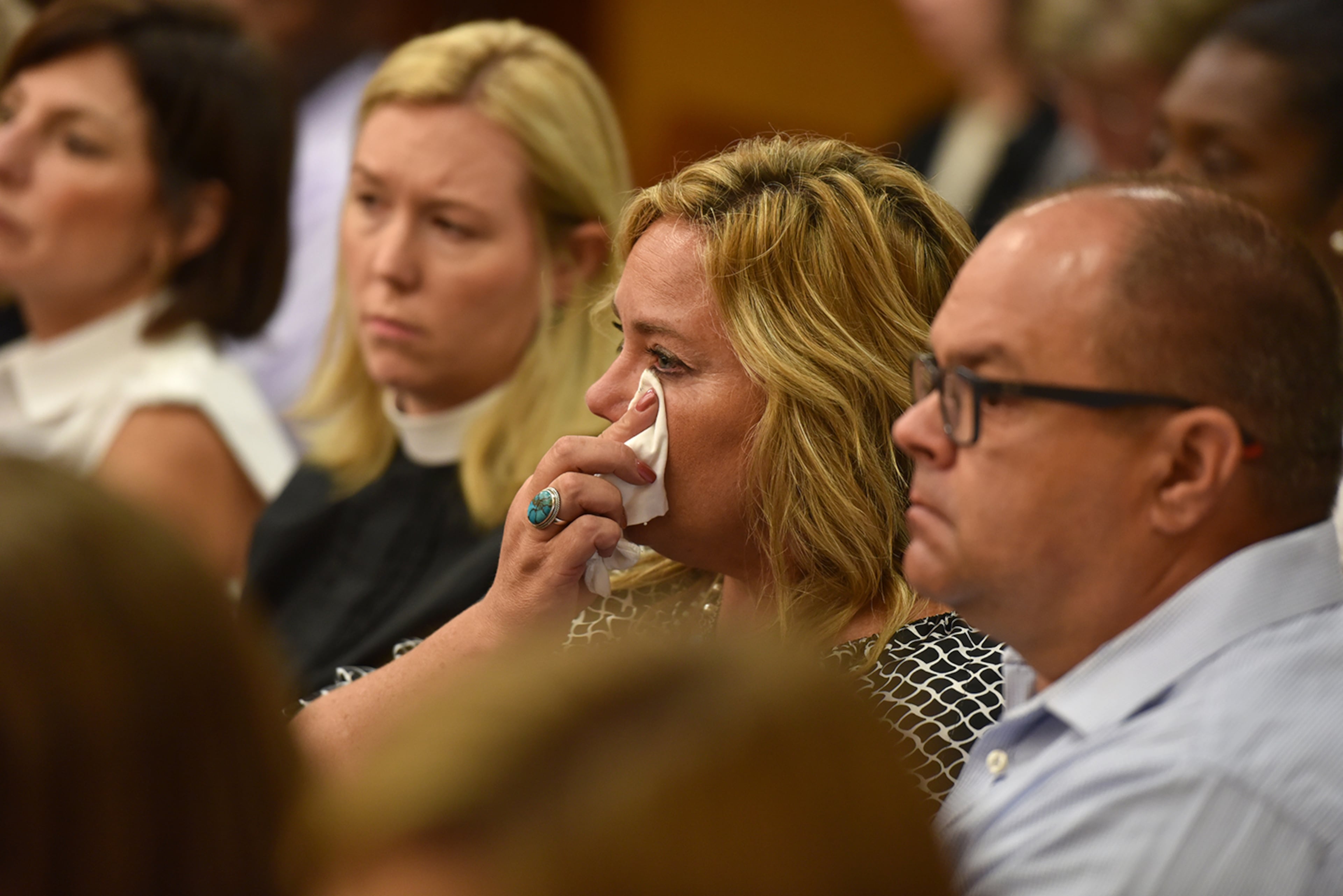 Family and friends of victims Carter Davis and Natalie Henderson listen to the testimony of Roswell Police Department detective Jennifer Bennett during the probable cause hearing of Jeffrey Hazelwood. (BRANT SANDERLIN/BSANDERLIN@AJC.COM)