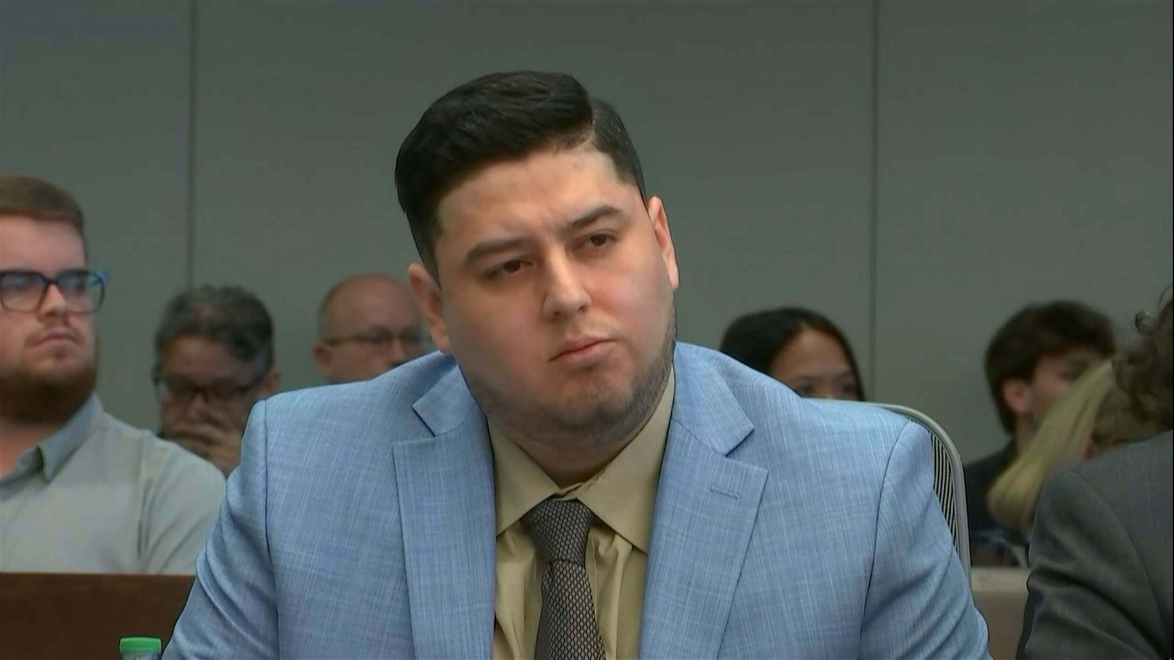 In this frame grab from video, Miguel Salguero Olivares, who is on trial for the murder and rape of University of North Carolina student Faith Hedgepeth, listens to the prosecution's opening argument at a courthouse in Durham, N.C., on Wednesday, Oct. 7, 2026. (Network Pool/via AP)