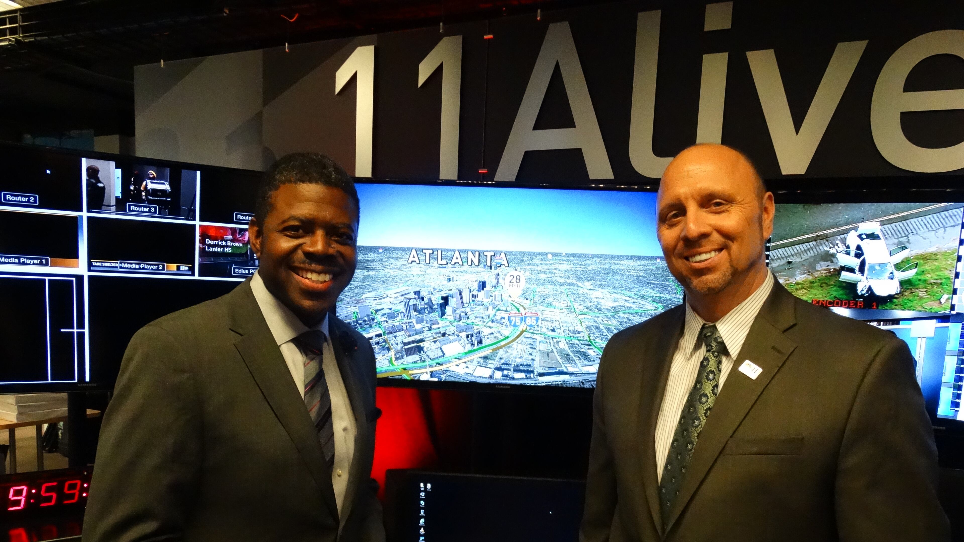 Chesley McNeil, an 11 Alive meteorologist since 2009, and Christopher "Crash" Clark, who has been with 11 Alive covering traffic since early 2014. CREDIT: Rodney Ho/ rho@ajc.com