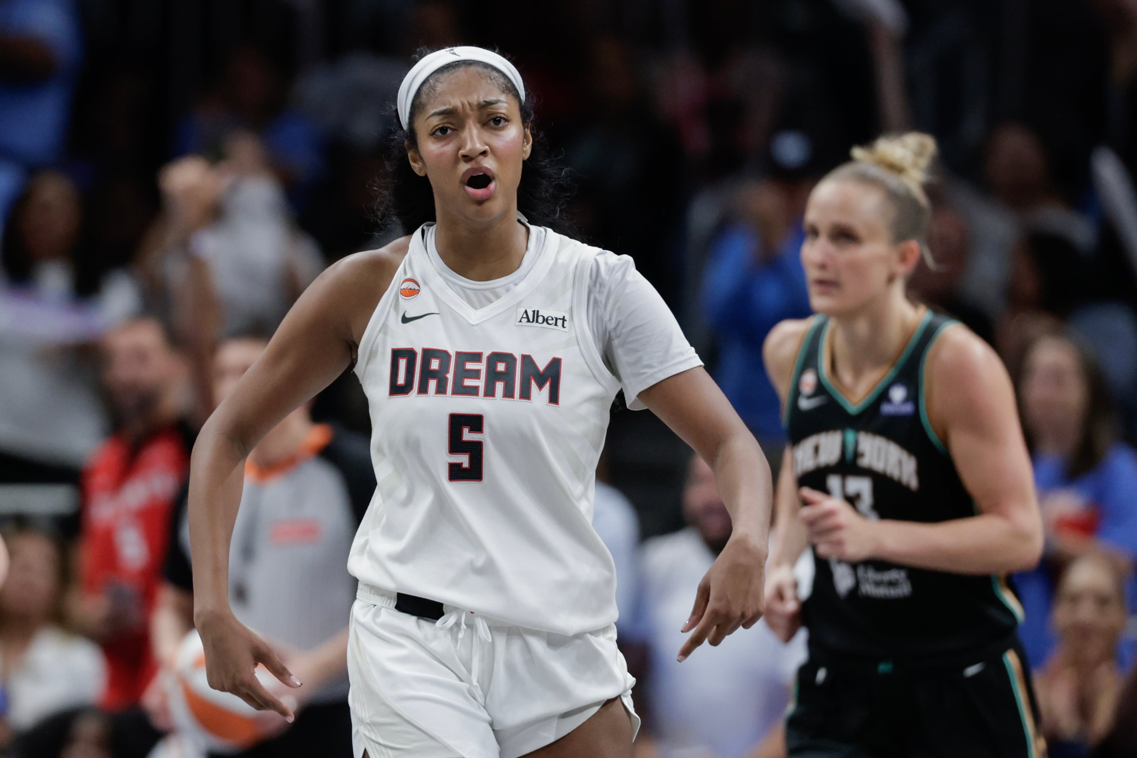 Atlanta Dream forward Angel Reese (5) reacts against the New York Liberty during the second half of a WNBA semifinal playoff game 1 between the Atlanta Dream and the New York Liberty, Sunday, Oct. 4, 2026, in Atlanta. (Erik S. Lesser for the AJC)