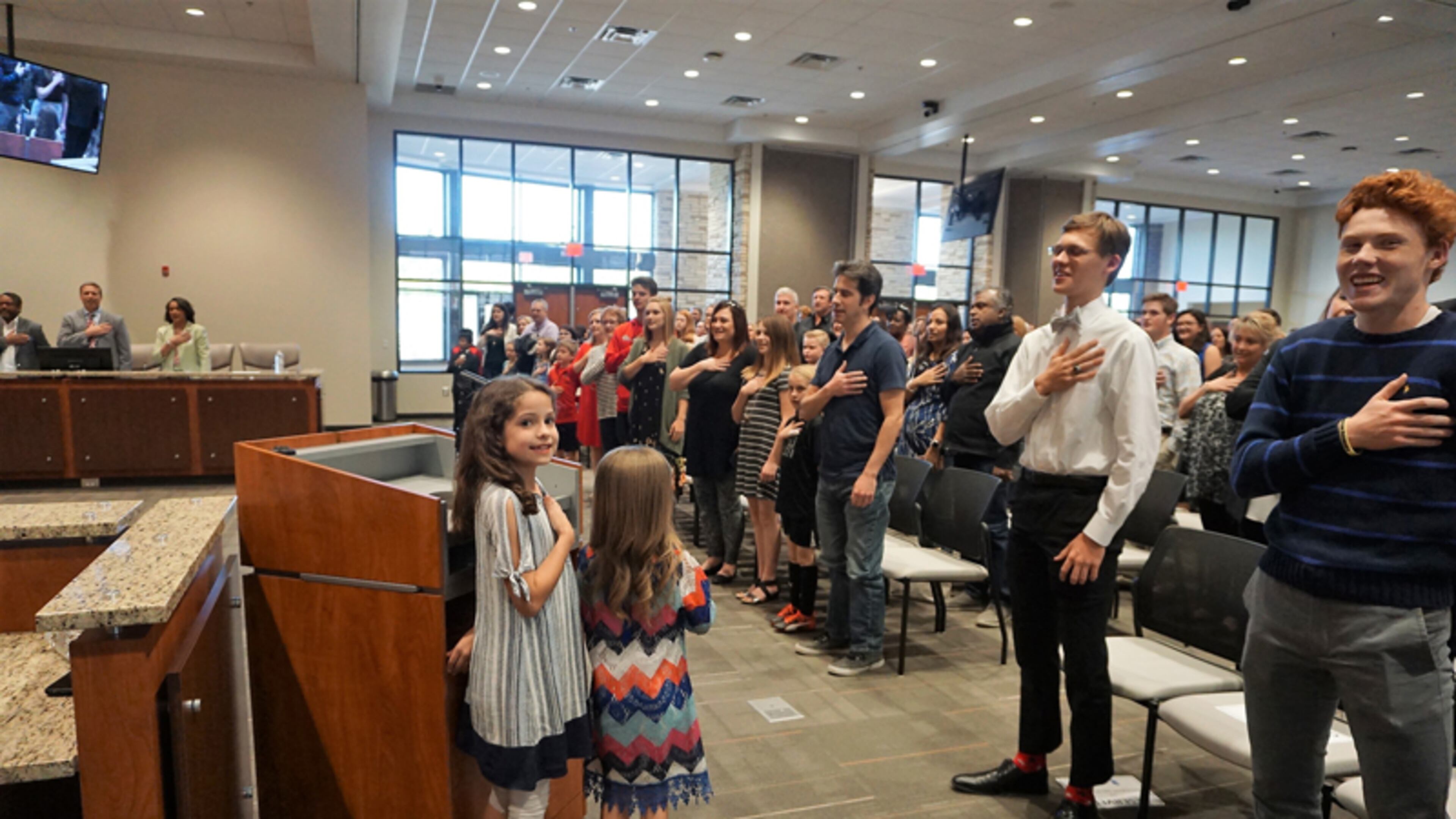 The Pledge of Allegiance at a recent Cherokee County School Board meeting is led by children of newly appointed assistant principal Julie Dutko. CHEROKEE COUNTY SCHOOLS