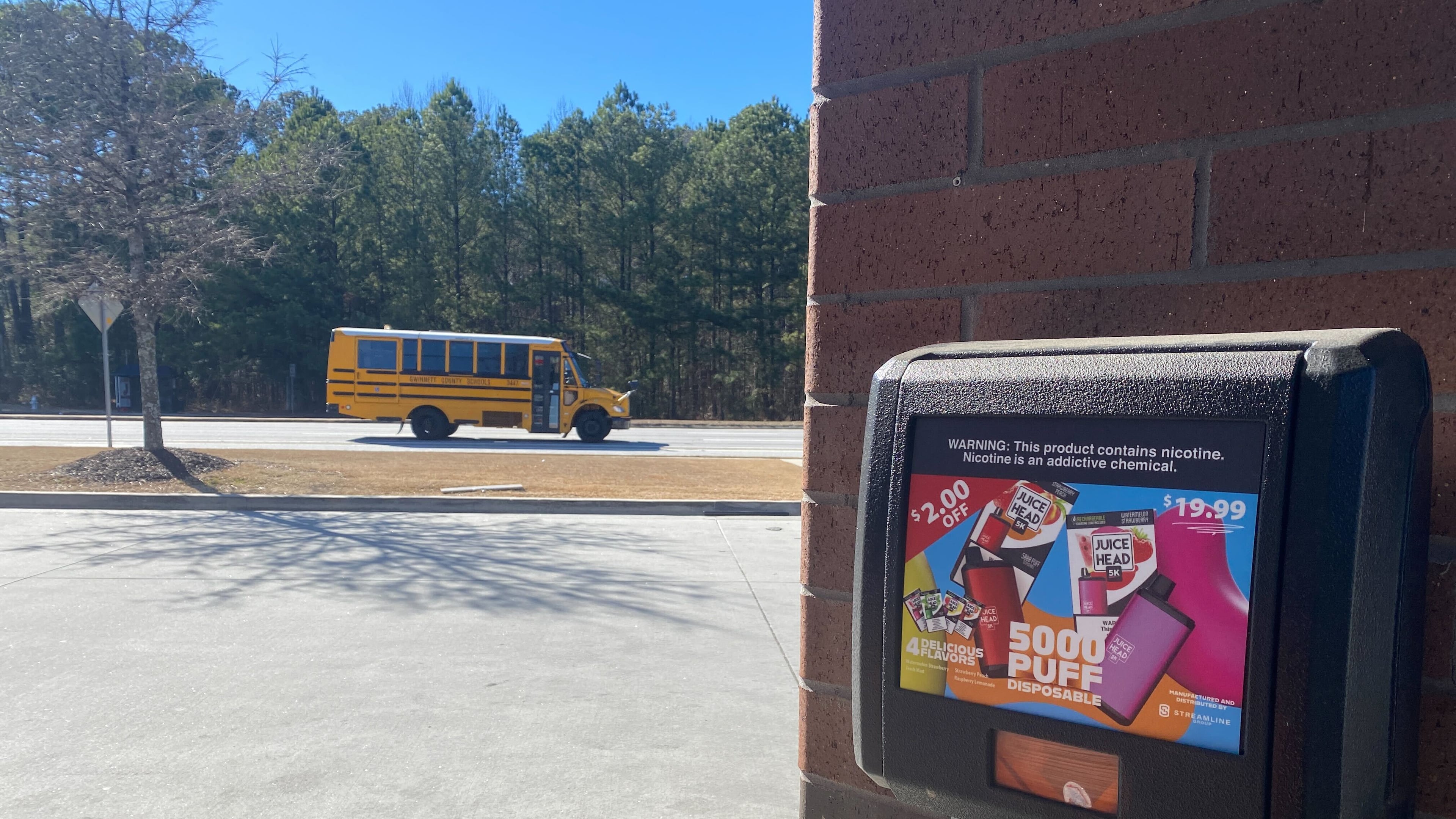 A gas station in Lawrenceville advertises fruit-flavored disposable vape devices. The devices are not authorized for sale by the U.S. Food and Drug Administration. The gas station is near three Gwinnett County high schools. (Josh Reyes / Josh.Reyes@ajc.com)