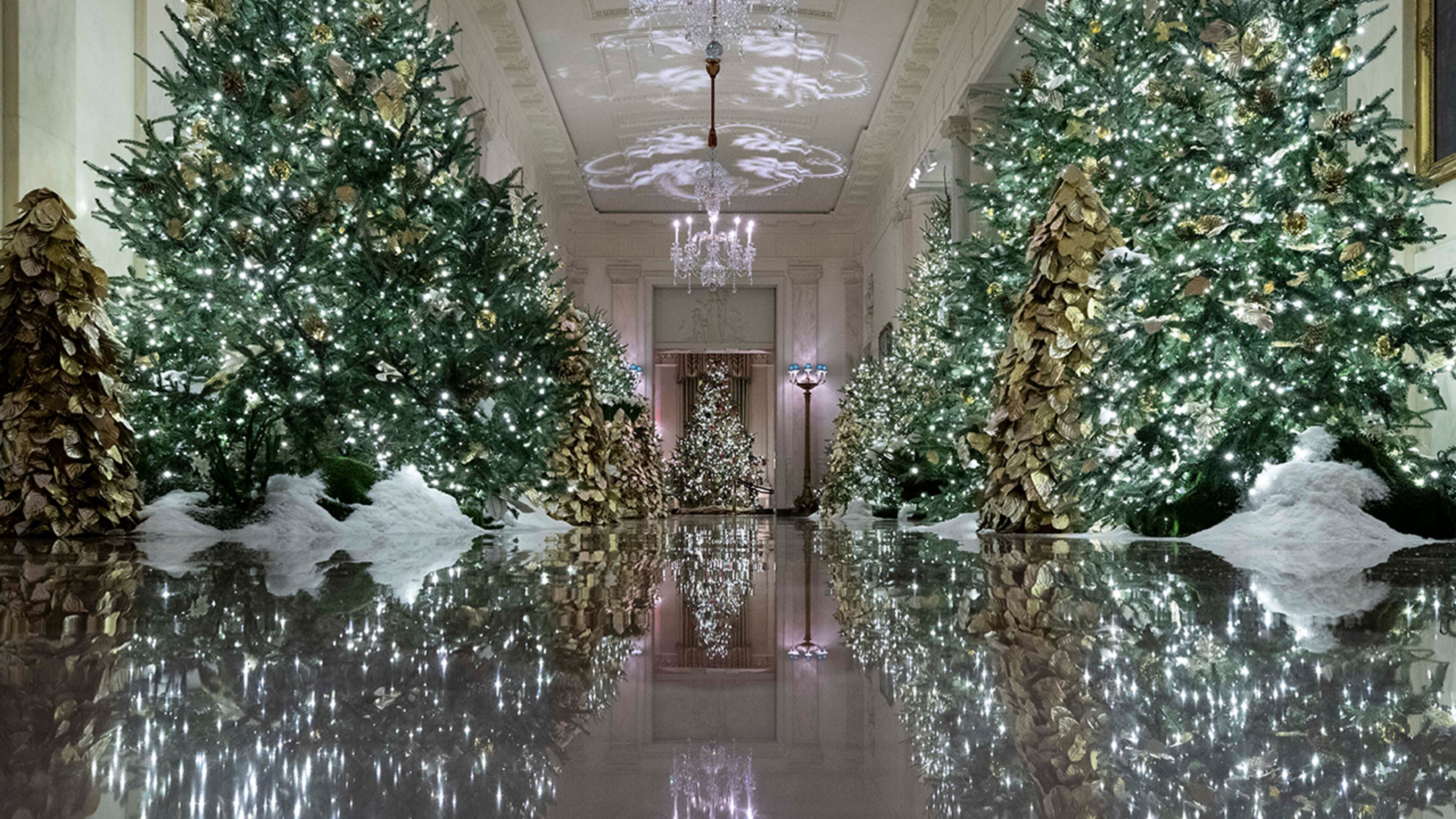 The Cross Hall leading into the State Dinning Room is decorated during the 2019 Christmas preview at the White House, Monday, Dec. 2, 2019, in Washington. (AP Photo/Alex Brandon)