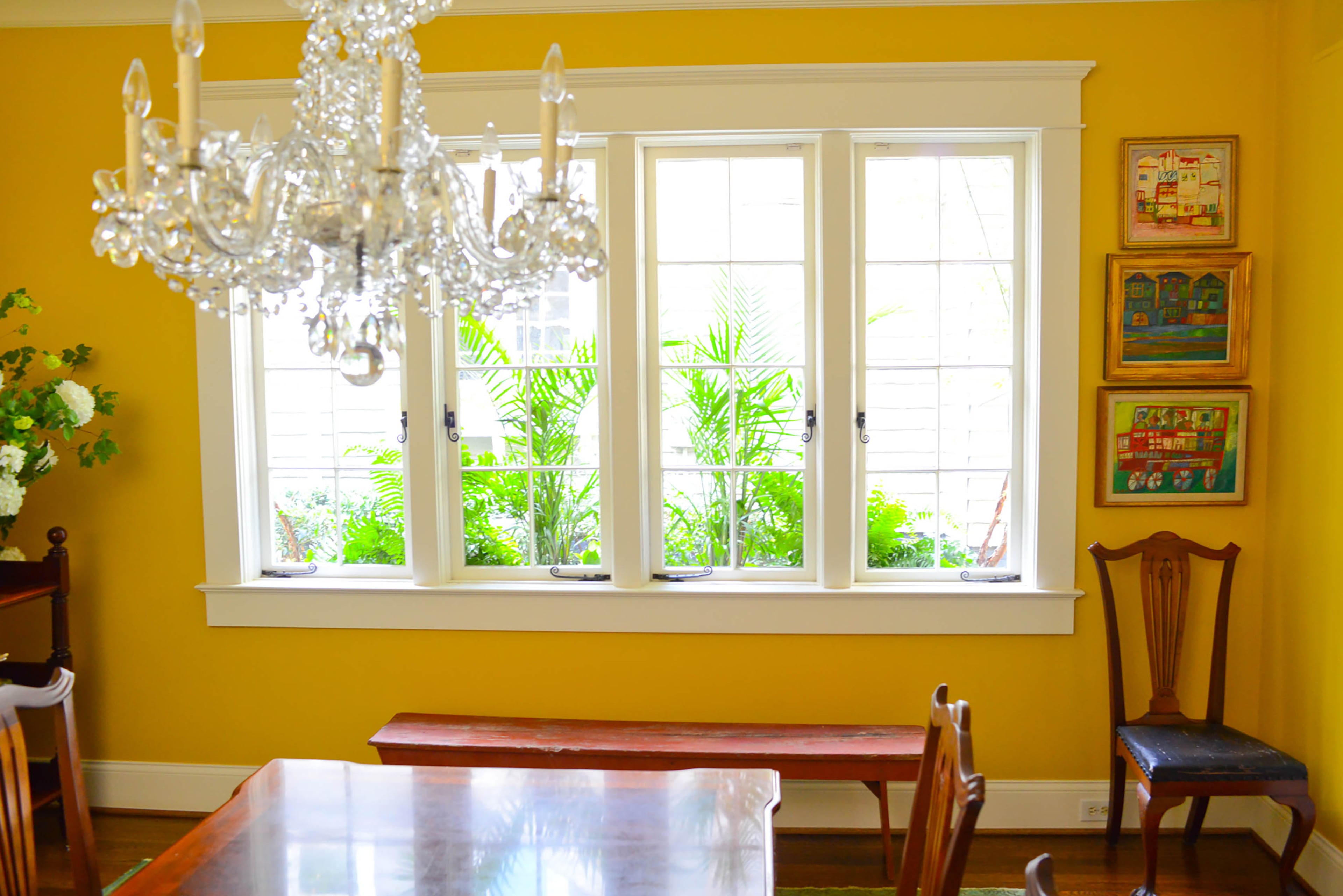 The dining room windows are among Jill Helmer's favorite architectural elements, particularly when flowers are in bloom in the window box. A custom mix by Pratt & Lambert gives the room a cheerful tone.