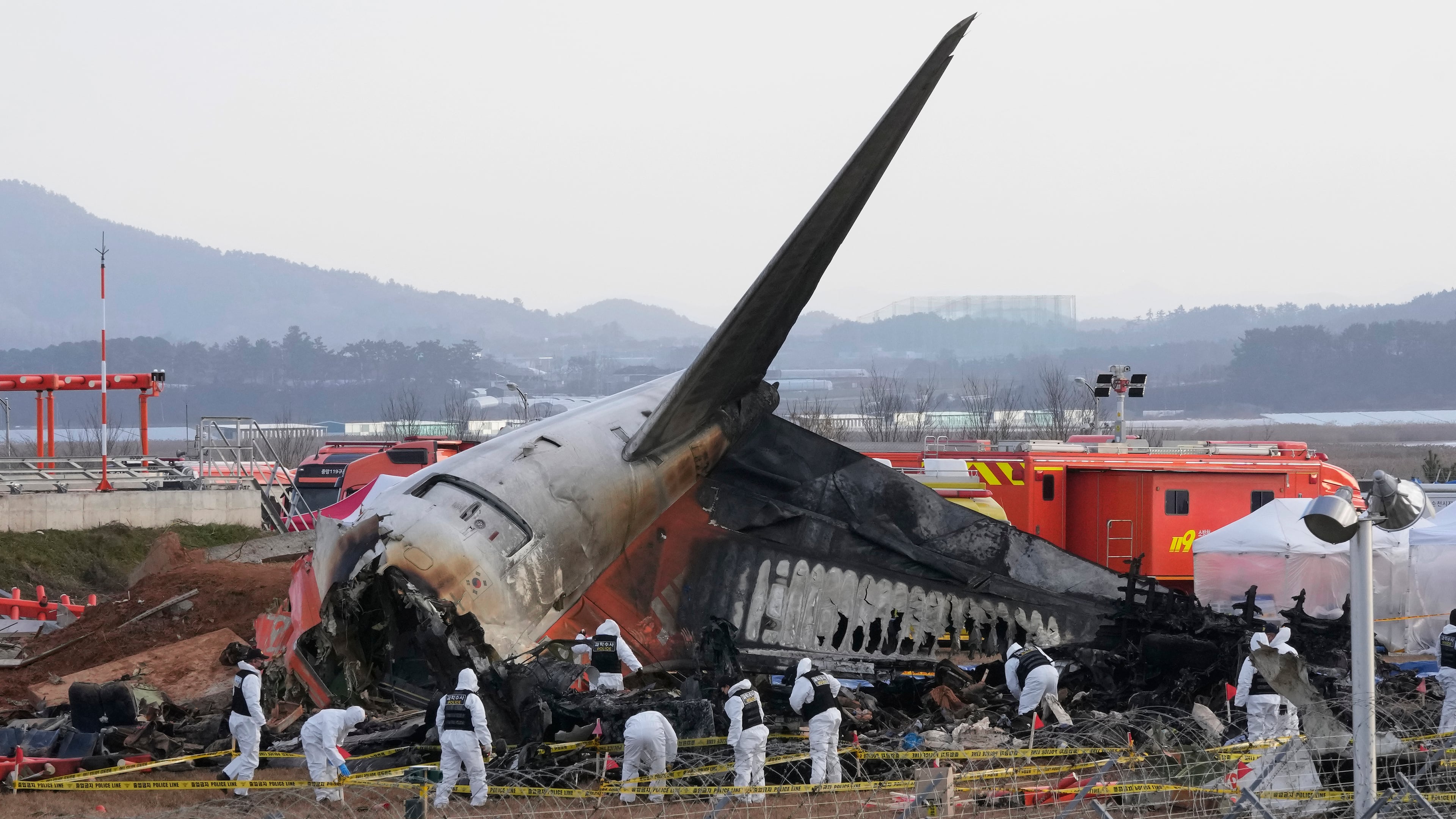 FILE - Rescue team members work at the site of a plane crash at Muan International Airport in Muan, South Korea on Dec. 31, 2024. (AP Photo/Ahn Young-joon, File)