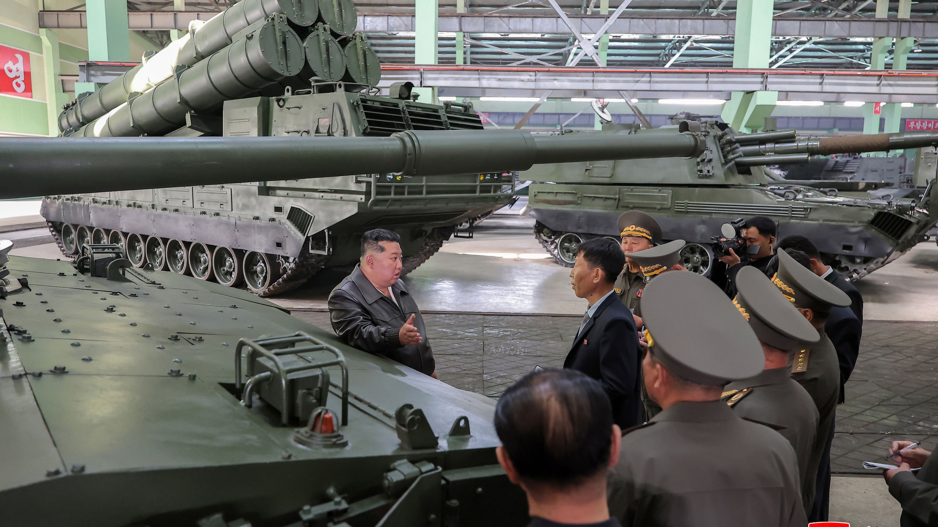 In this photo provided on May 8, 2026, by the North Korean government, its leader Kim Jong Un, center, visits a major munitions factory at an undisclosed location, North Korea Wednesday, May 6, 2026. Independent journalists were not given access to cover the event depicted in this image distributed by the North Korean government. The content of this image is as provided and cannot be independently verified. Korean language watermark on image as provided by source reads: "KCNA" which is the abbreviation for Korean Central News Agency. (Korean Central News Agency/Korea News Service via AP)
