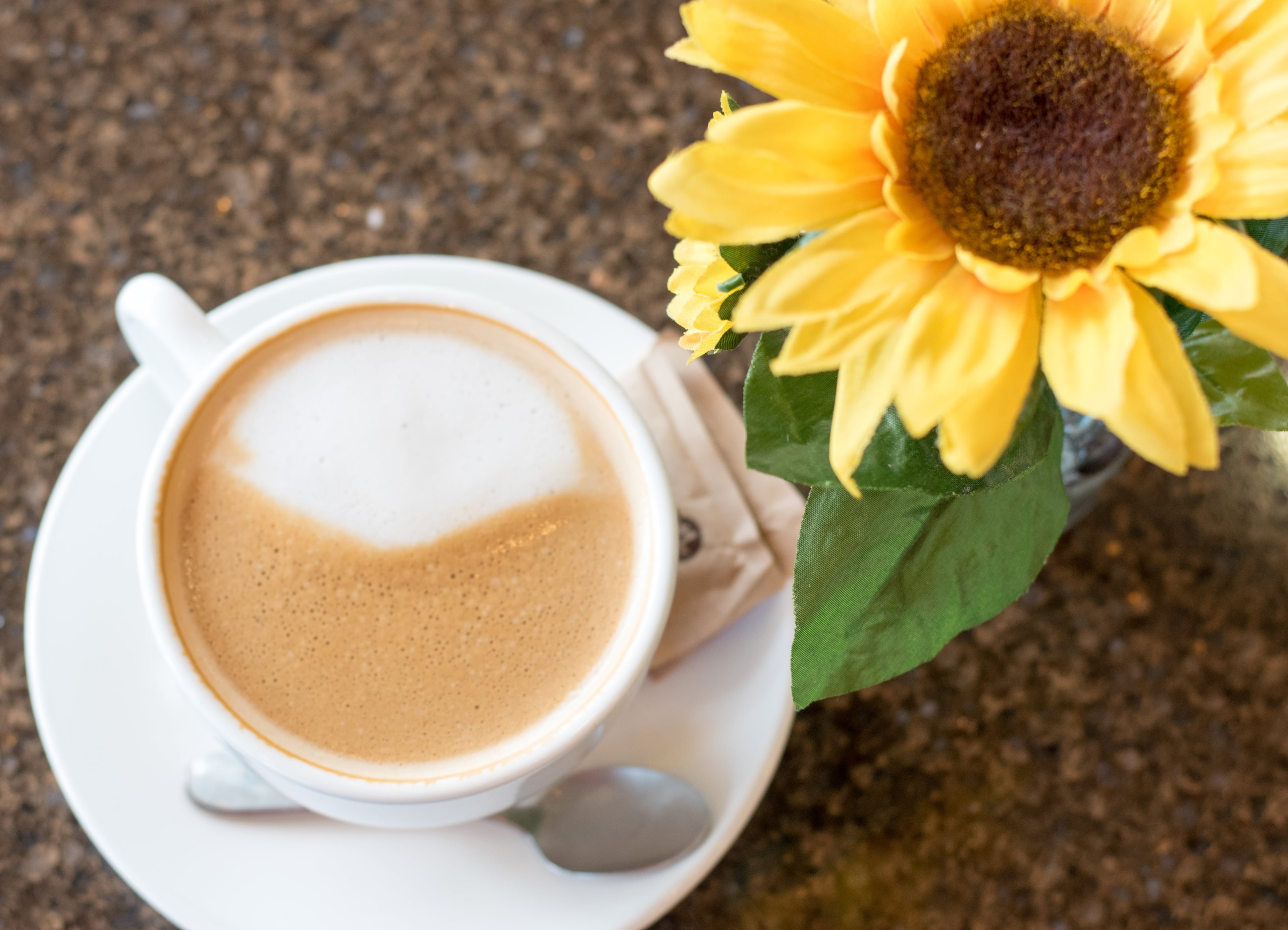 A latte at in Golden Drops Cafe, which draws on Central and South American culture. (Henri Hollis/AJC)
