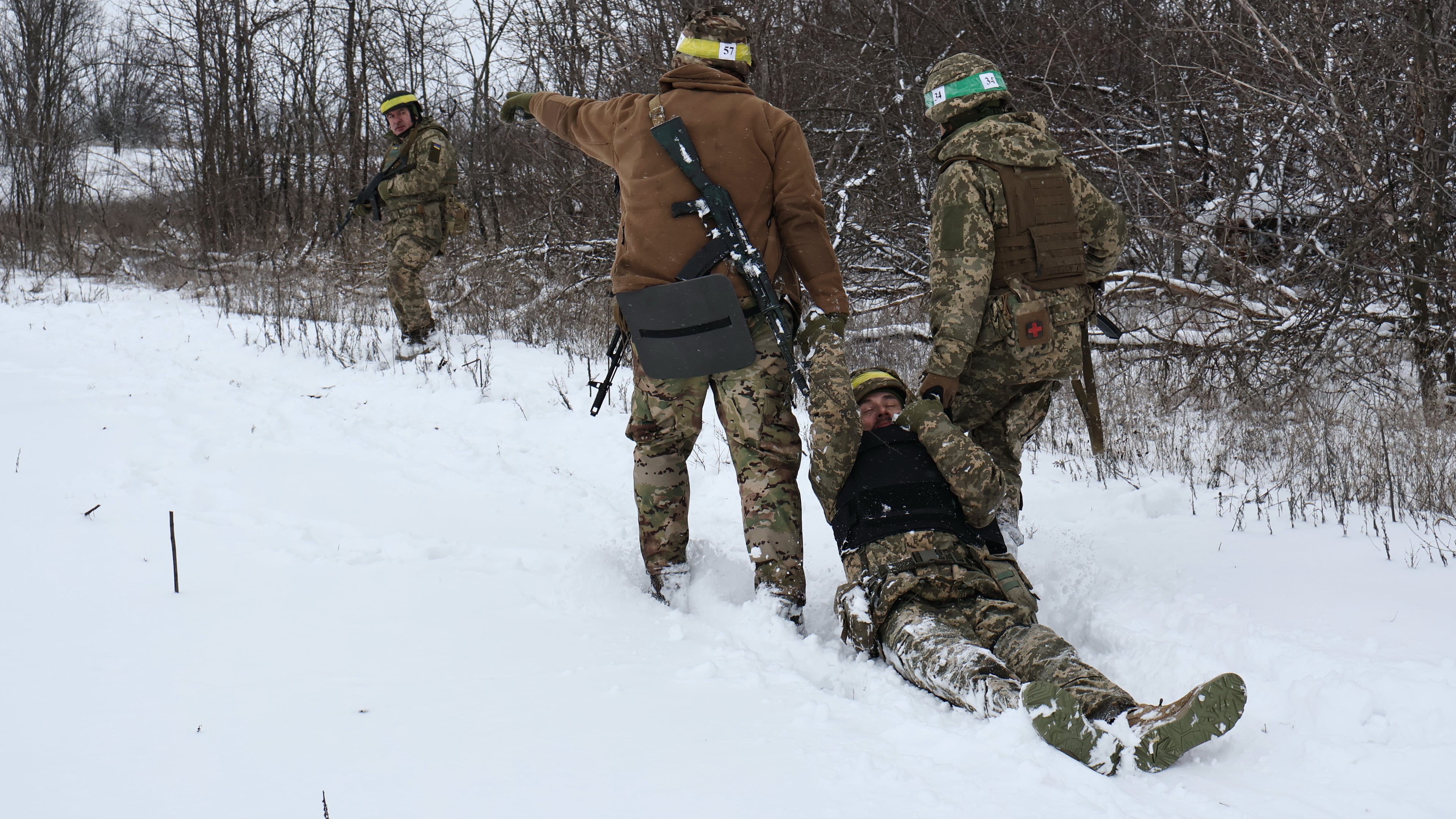 In this photo provided by Ukraine's 65th Mechanized Brigade press service, recruits attend drills at a training ground in the Zaporizhzhia region, Ukraine, Monday, Dec. 29, 2025. (Andriy Andriyenko/Ukraine's 65th Mechanized Brigade via AP)