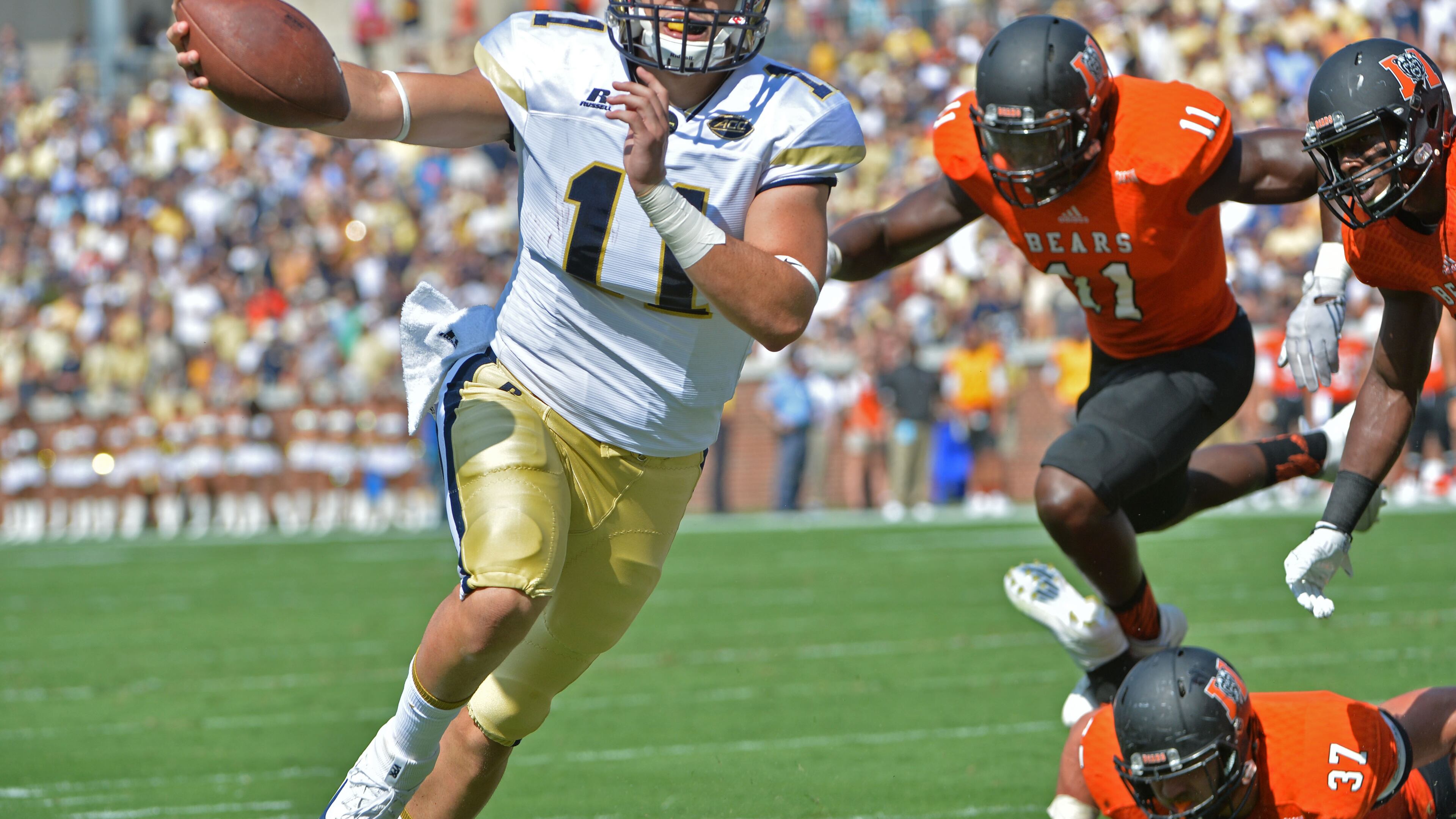 Georgia Tech Yellow Jackets quarterback Matthew Jordan (11) holds a football as he scores a touchdown in the first half at Bobby Dodd Stadium on Saturday, September 10, 2016. HYOSUB SHIN / HSHIN@AJC.COM