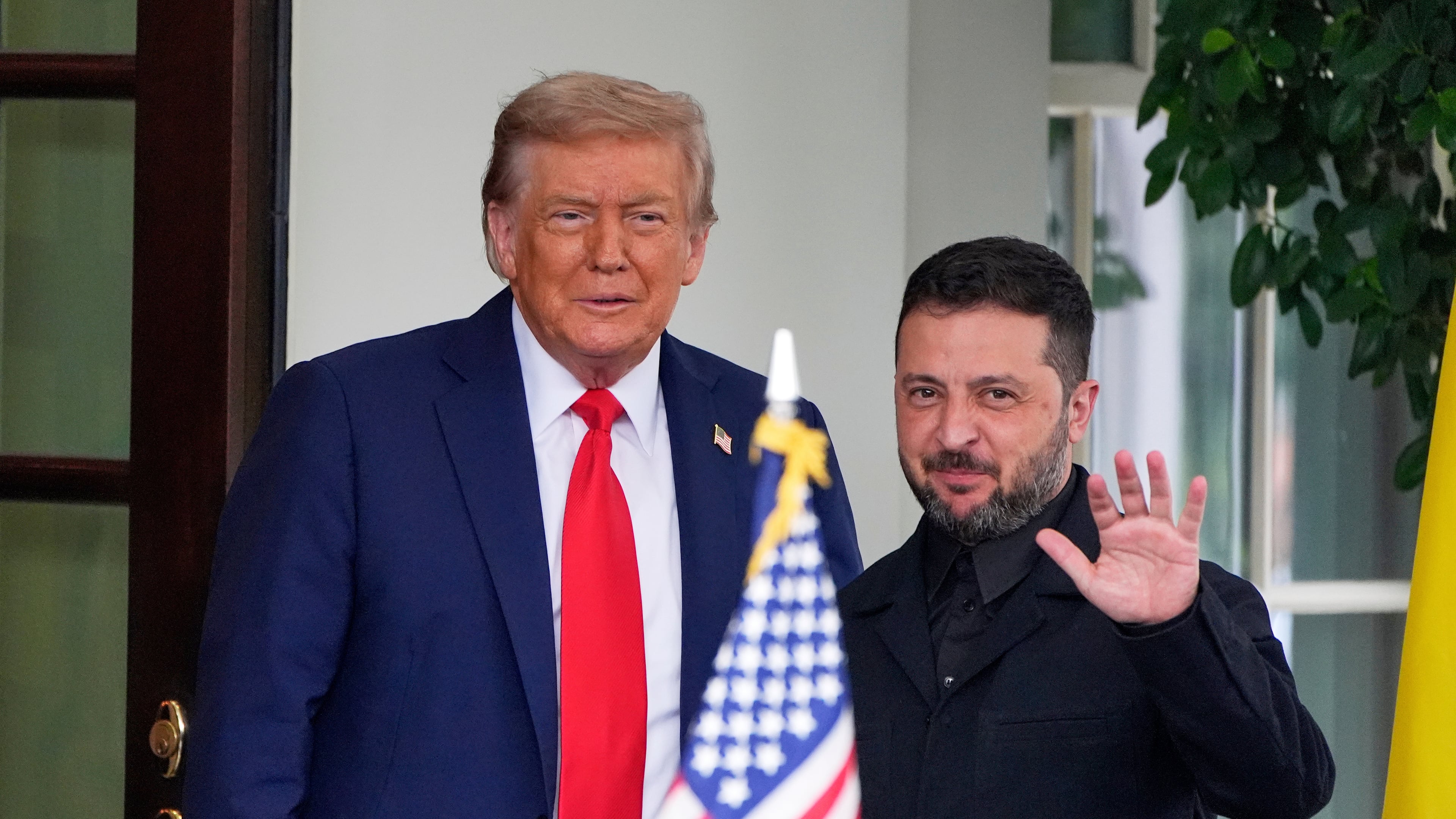 FILE - President Donald Trump, left, greets Ukraine's President Volodymyr Zelenskyy as he arrives at the White House, Aug. 18, 2025, in Washington. (AP Photo/Alex Brandon, File)
