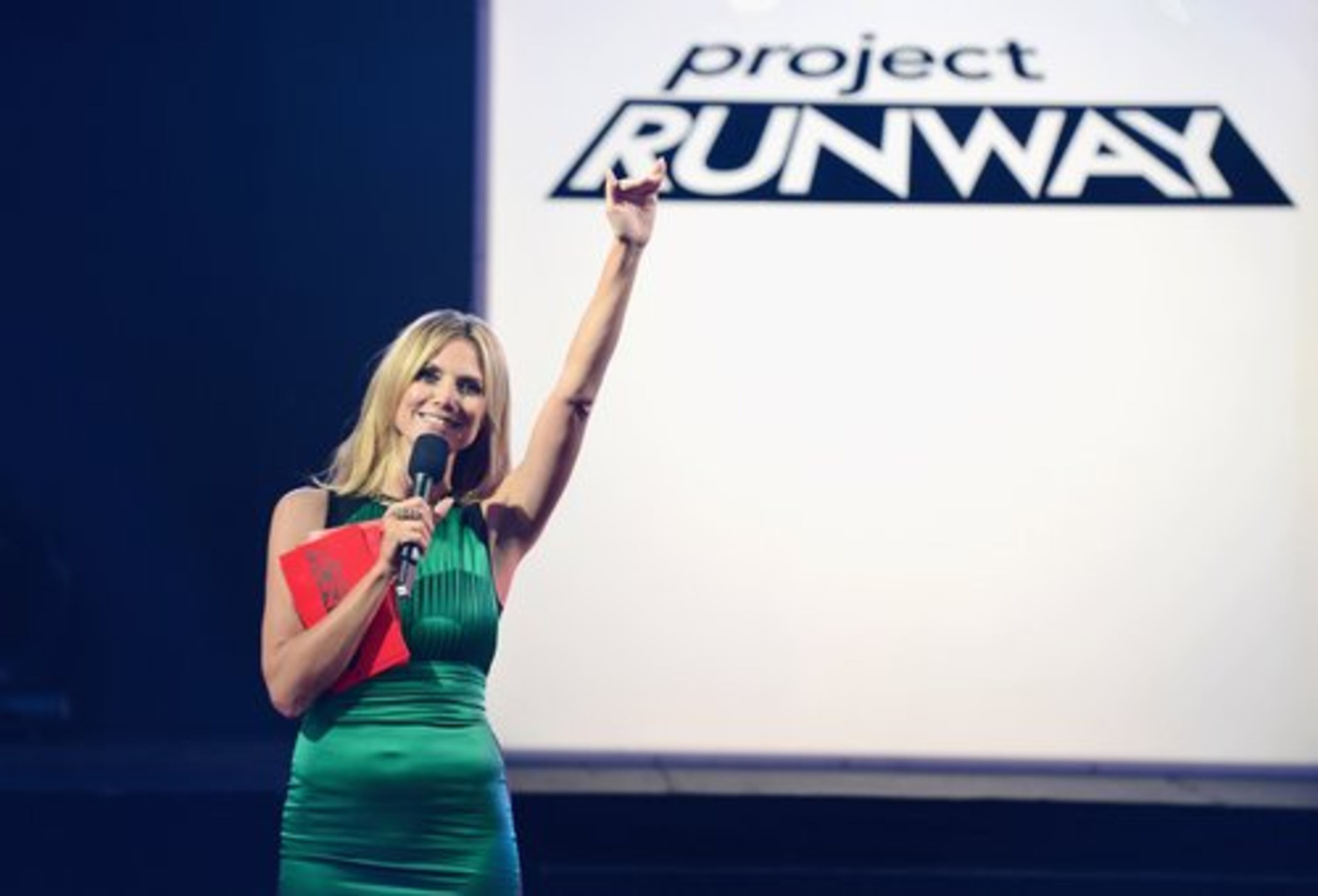 "Project Runway" host Heidi Klum welcomes contestants and the crowd to a fashion show in New York's Time Square kicking off the show's 10th season.