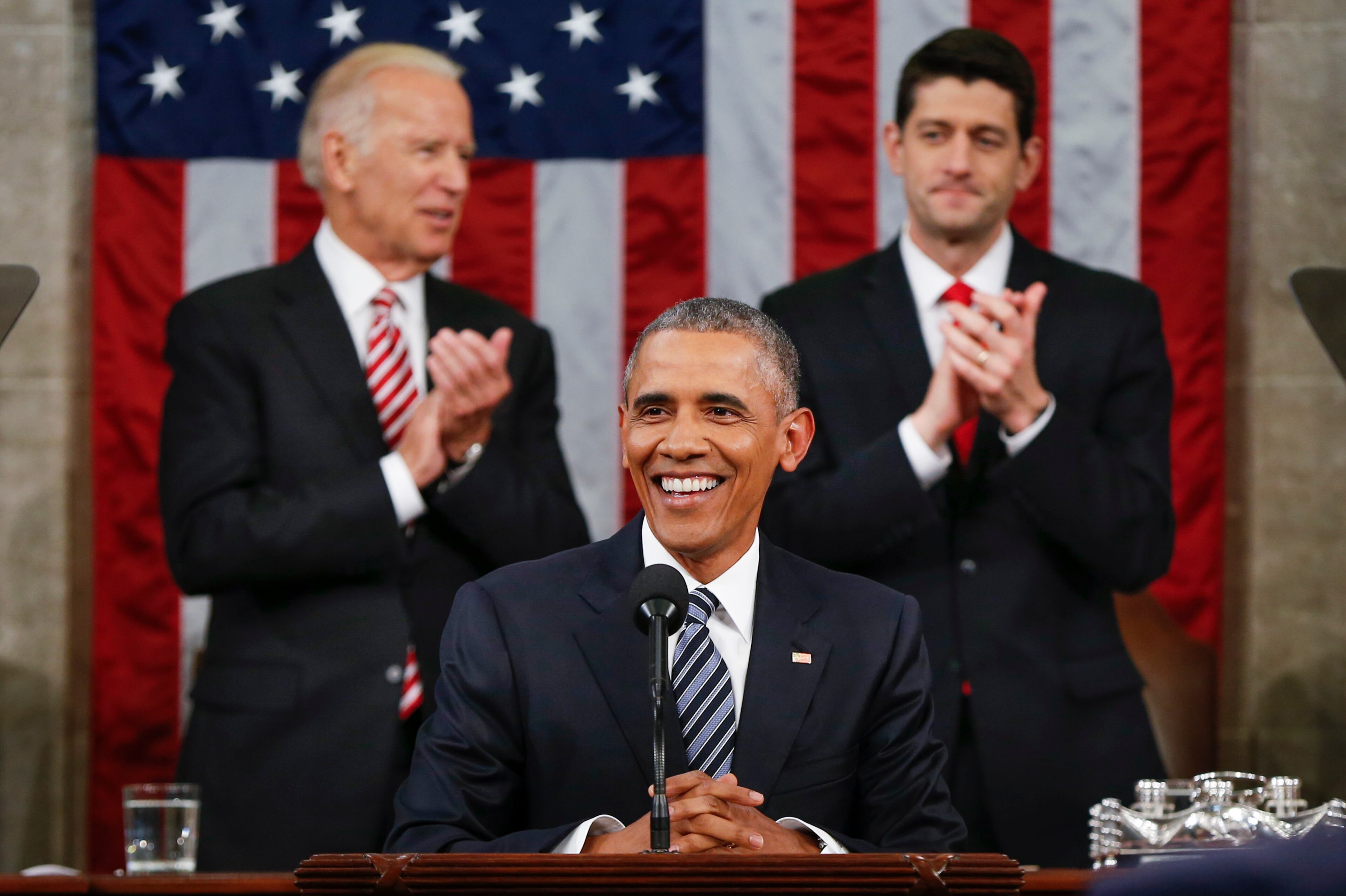 Vice President Joe Biden and Speaker Paul Ryan of Wisconsin applaud President Barack Obama during the State of the Union address before a joint session of Congress on Capitol Hill in Washington, Tuesday, Jan. 12, 2016. (AP Photo/Evan Vucci, Pool)