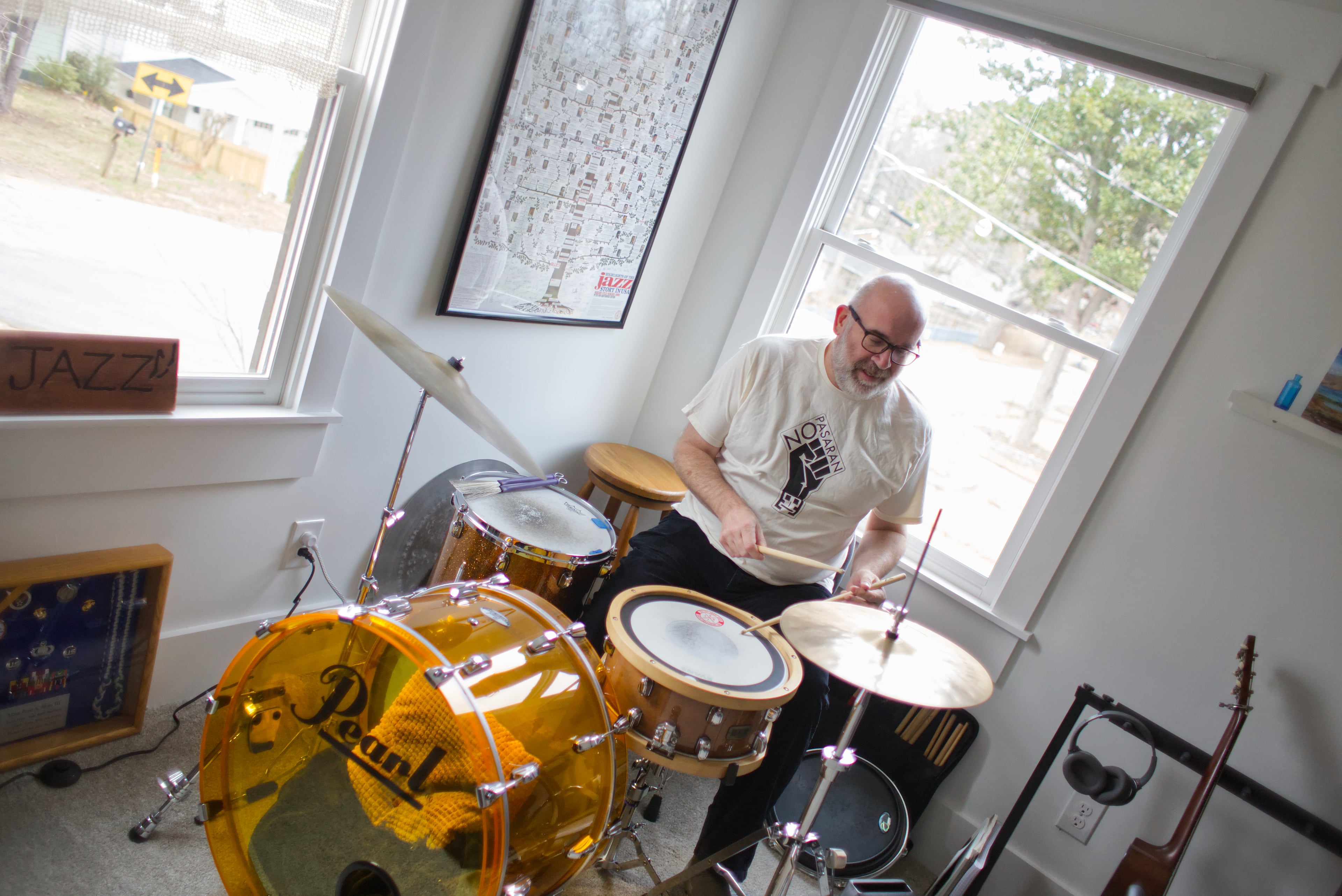 Paul Shaw, who was a jazz drummer in the United States Air Force Band, stays on the beat at home. Paul teaches guitar and cajon (a Peruvian percussion instrument) at Decatur’s Frank Hamilton School of music and gigs with groups such as Evan Stepp & the Piners. (Courtesy of Dustin Timbrook)