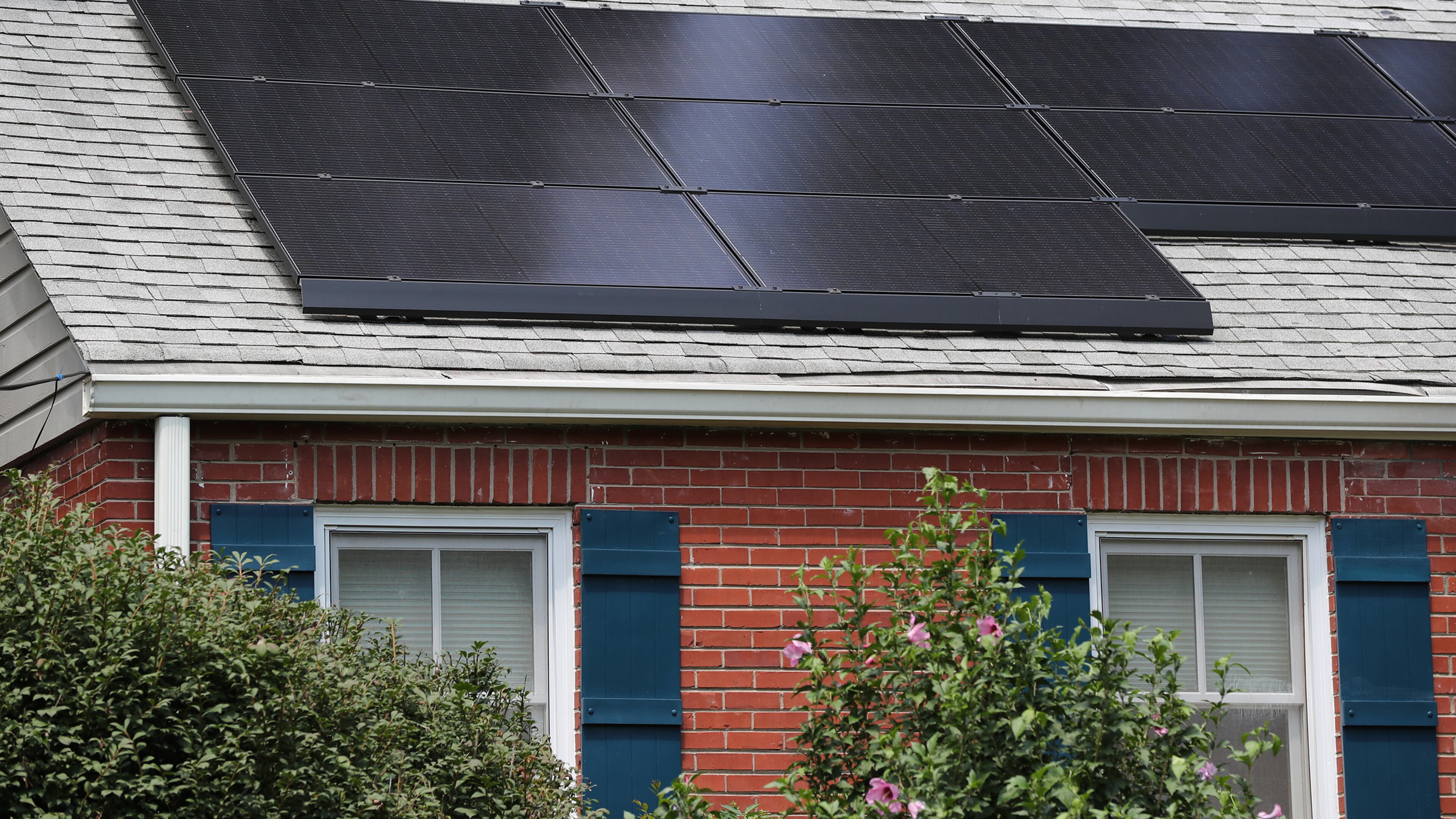 Cities and individuals around Georgia, such as the owners of this Decatur home with solar panels, are working toward clean energy. (Curtis Compton / ccompton@ajc.com)