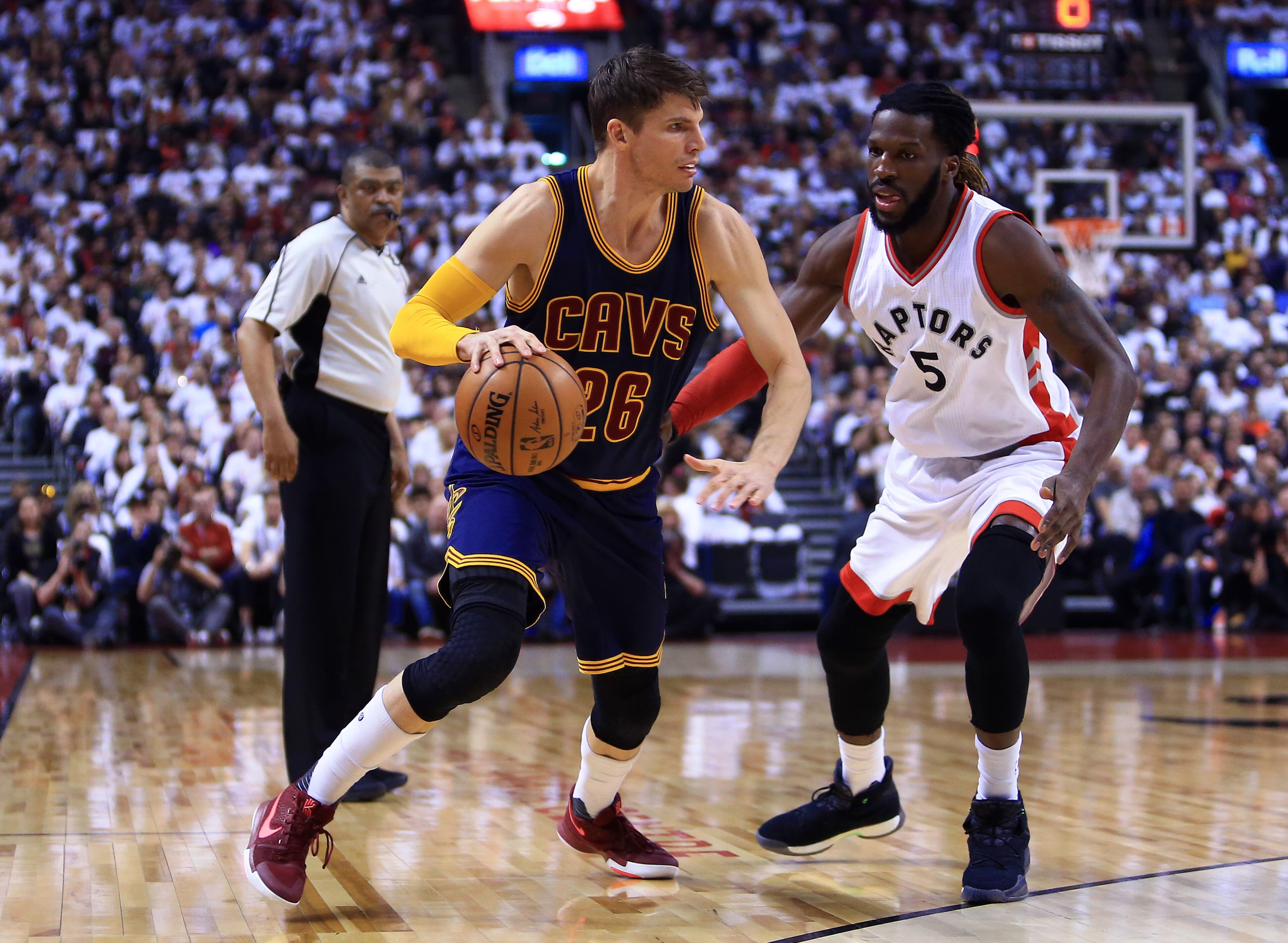TORONTO, ON - MAY 07: Kyle Korver #26 of the Cleveland Cavaliers dribbles the ball as DeMarre Carroll #5 of the Toronto Raptors defends in the first half of Game Four of the Eastern Conference Semifinals during the 2017 NBA Playoffs at Air Canada Centre on May 7, 2017 in Toronto, Canada. NOTE TO USER: User expressly acknowledges and agrees that, by downloading and or using this photograph, User is consenting to the terms and conditions of the Getty Images License Agreement. (Photo by Vaughn Ridley/Getty Images)